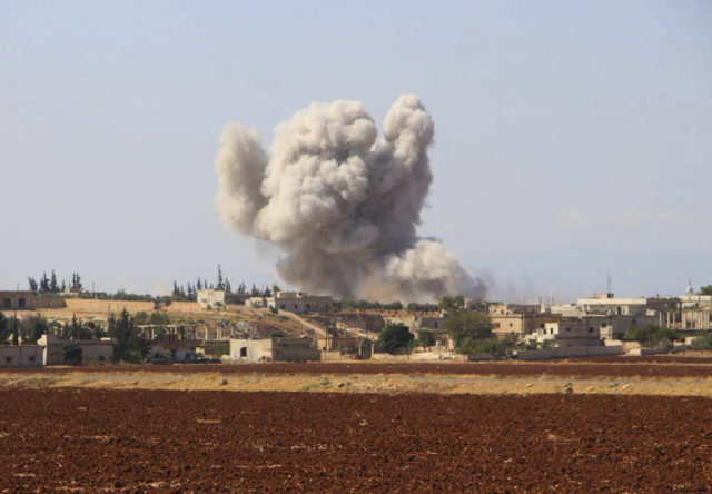 Smoke rising from a Syrian government air strike in Hobeit village