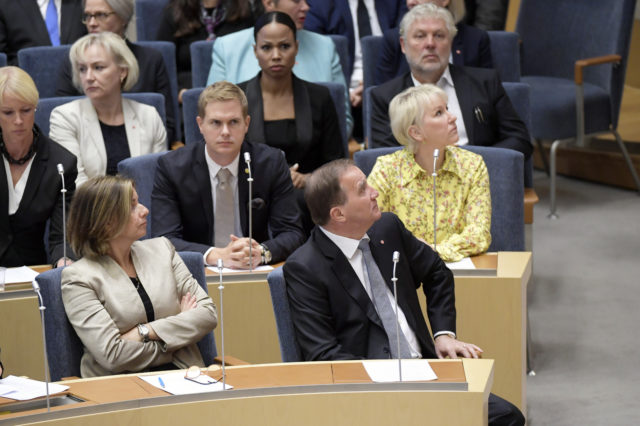 Stefan Lofven, right, during the vote of confidence