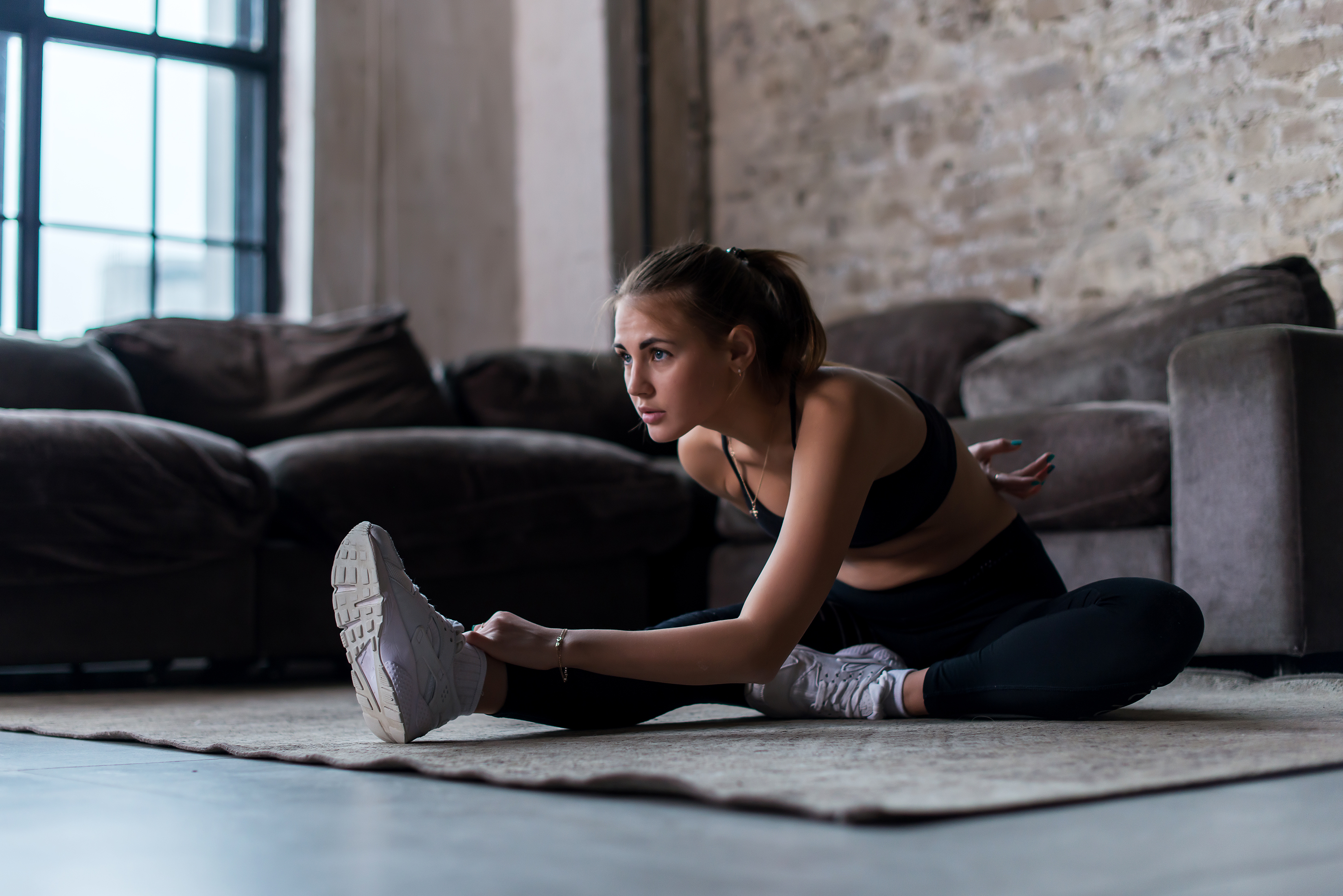 A woman stretching at home