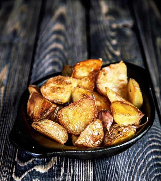 Baked potato wedges with garlic, christmas garnish