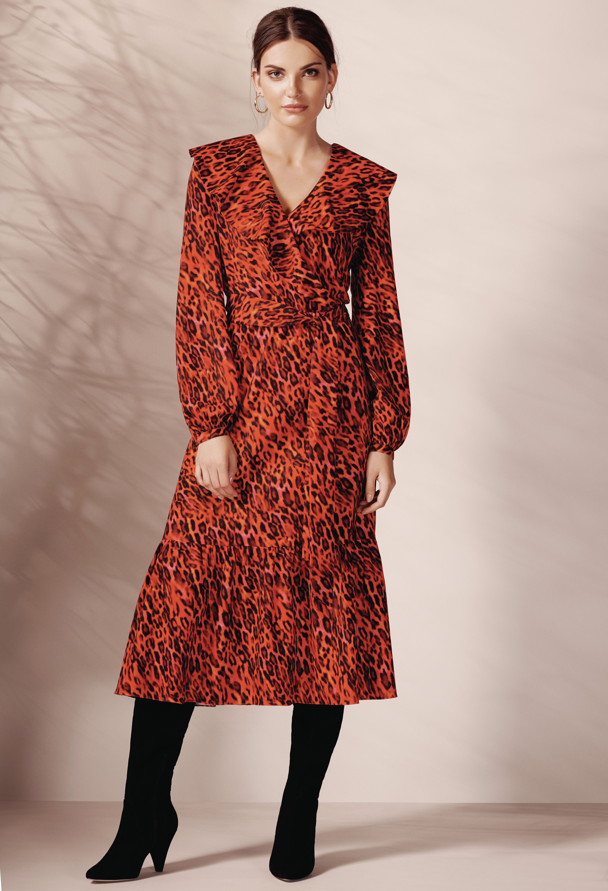 model wearing Wallis Red Animal Print Midi Fit and Flare Dress and Rose Gold Thick Hoop Earrings
