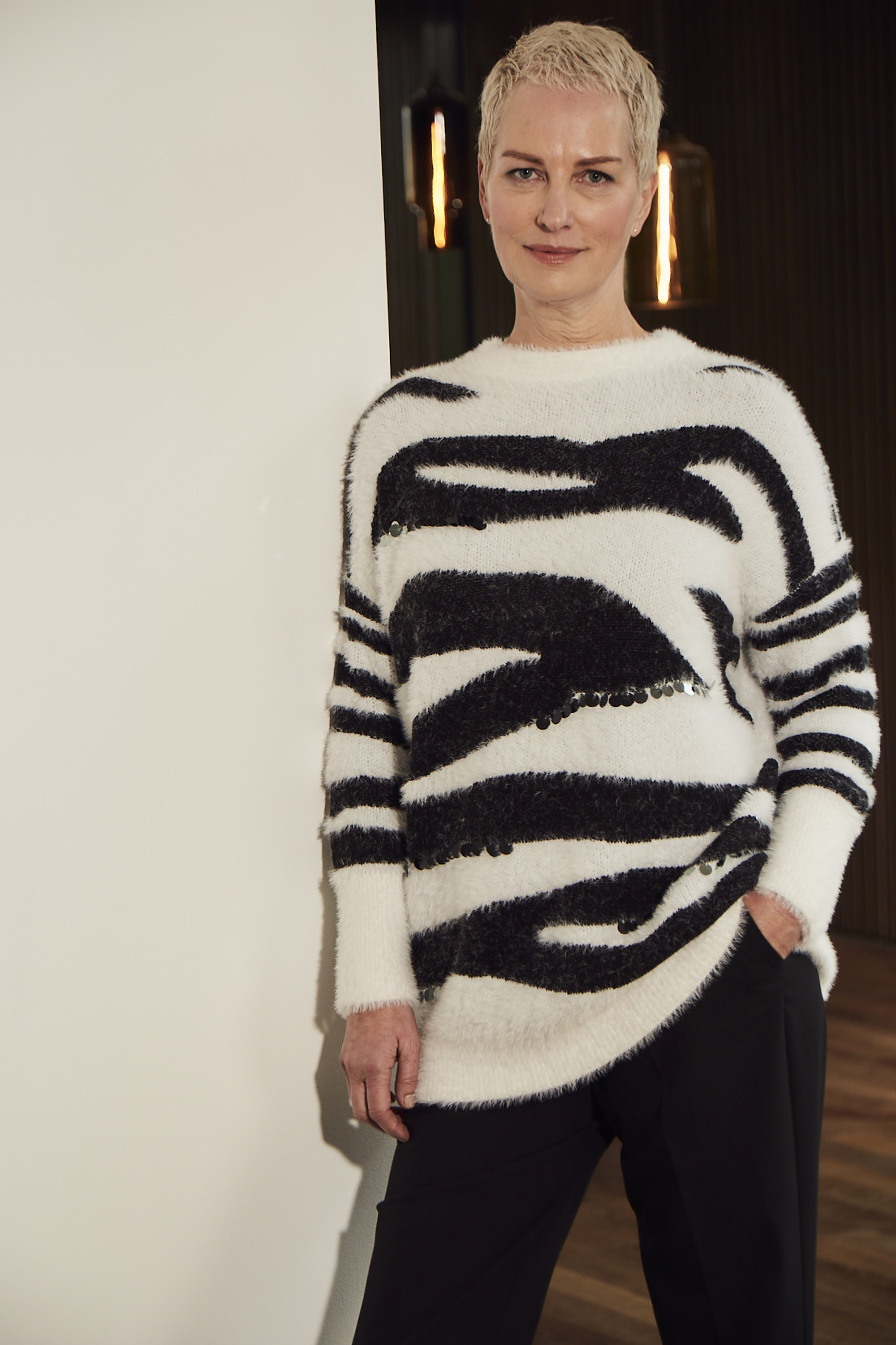 model wearing JD Williams Brushed Zebra Tunic with Sequin Detail, Magi Petite Straight Leg Trousers