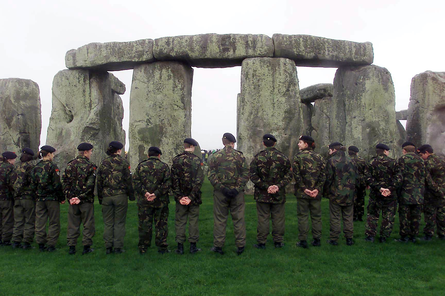 Army cadets and members of the Royal British Legion forming a circle of remembrance at Stonehenge in 2000