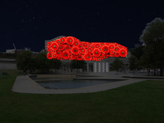 Scottish Parliament illuminated with poppies