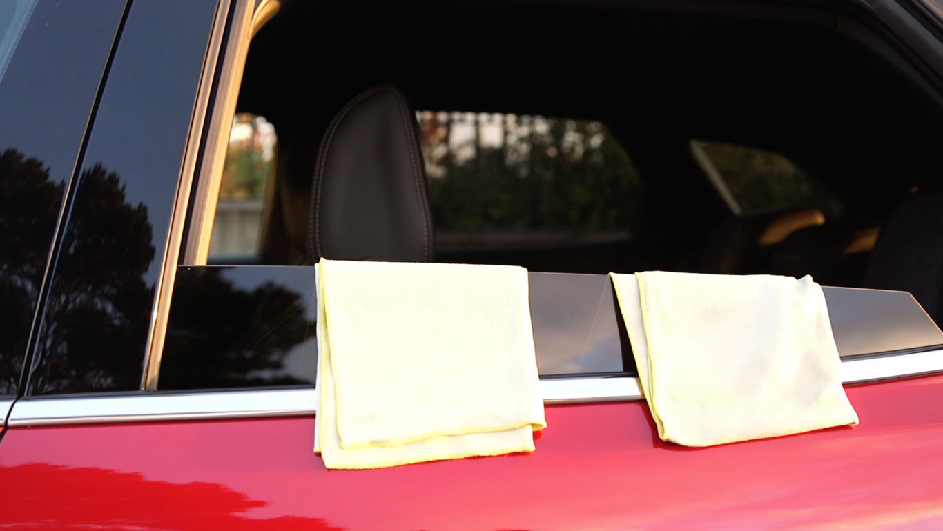 Two cloths are required to properly clean a car's windows
