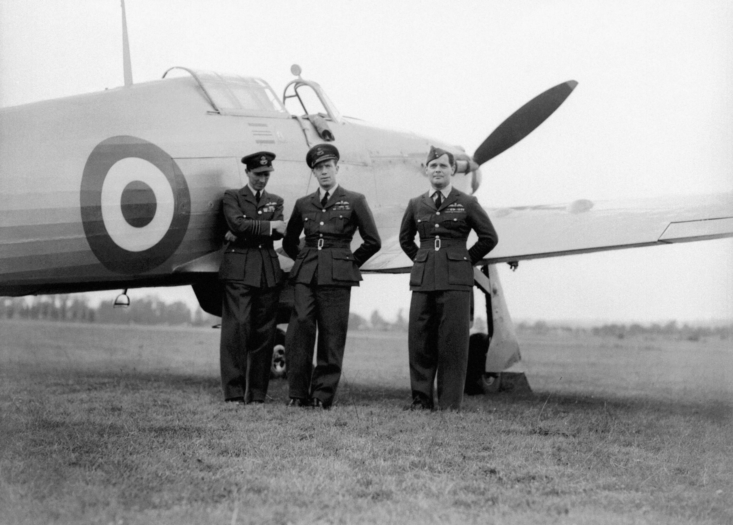 Douglas Bader, right, with fellow crew members stand beside a Hurricane during a break in hostilities during the Second World War