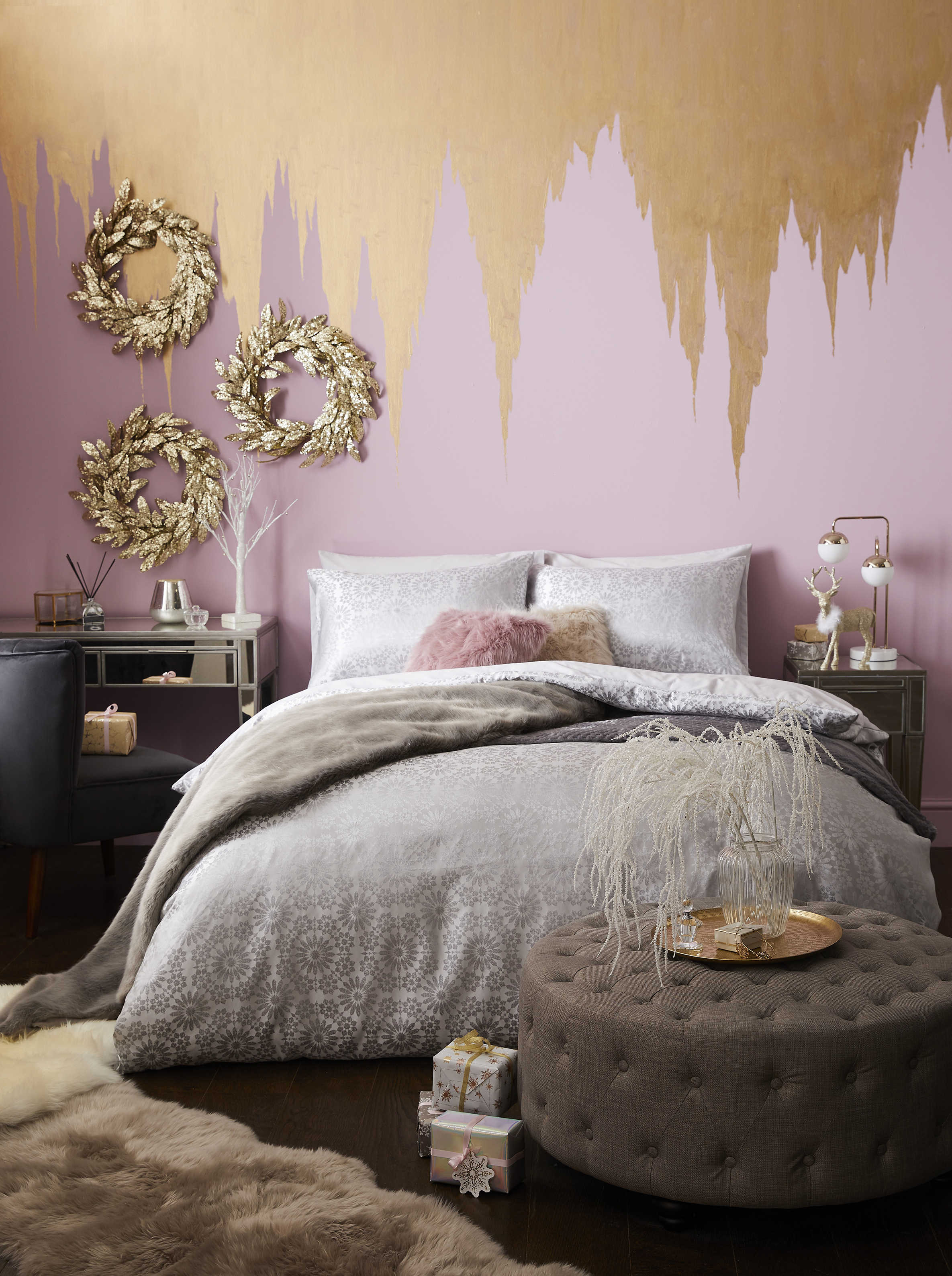 Fitzgerald Bedside Table £149; Pippa Brown Circular Footstool, £199; Elsie Silver Jacquard Duvet Cover & Pillowcase Set, from £26-£42; Faux Fur Throw from £30 each; 5A Fifth Avenue Skara Marble Sphere Champagne Table Lamp, £69; Glitter Laurel Wreath, £14, Dunelm (Dunelm/PA)