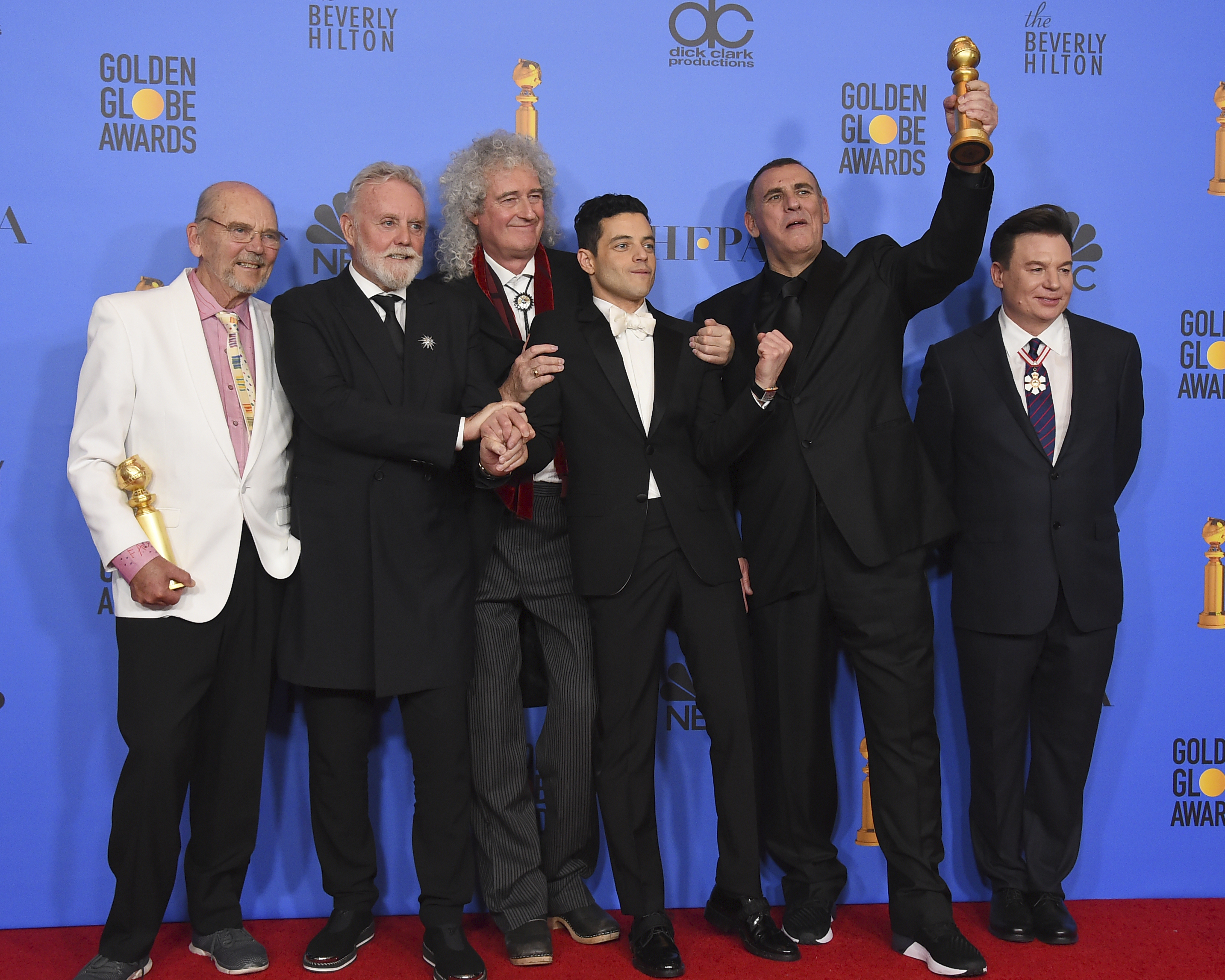 Jim Beach, from left, Roger Taylor, Brian May, Rami Malek, Graham King, and Mike Myers pose in the press room with the award for best motion picture, drama for "Bohemian Rhapsody" at the 76th annual Golden Globe Awards