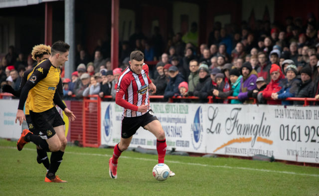 An Altrincham player playing at their ground