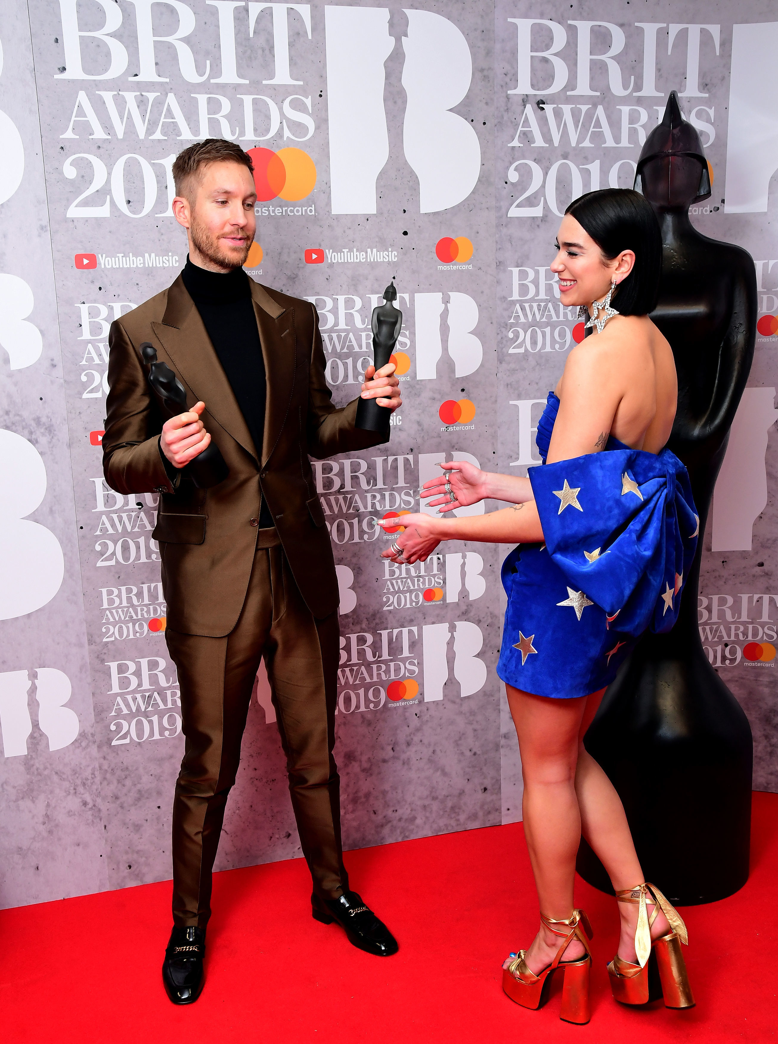 Dua Lipa and Calvin Harris with their Best British Single Brit Award 