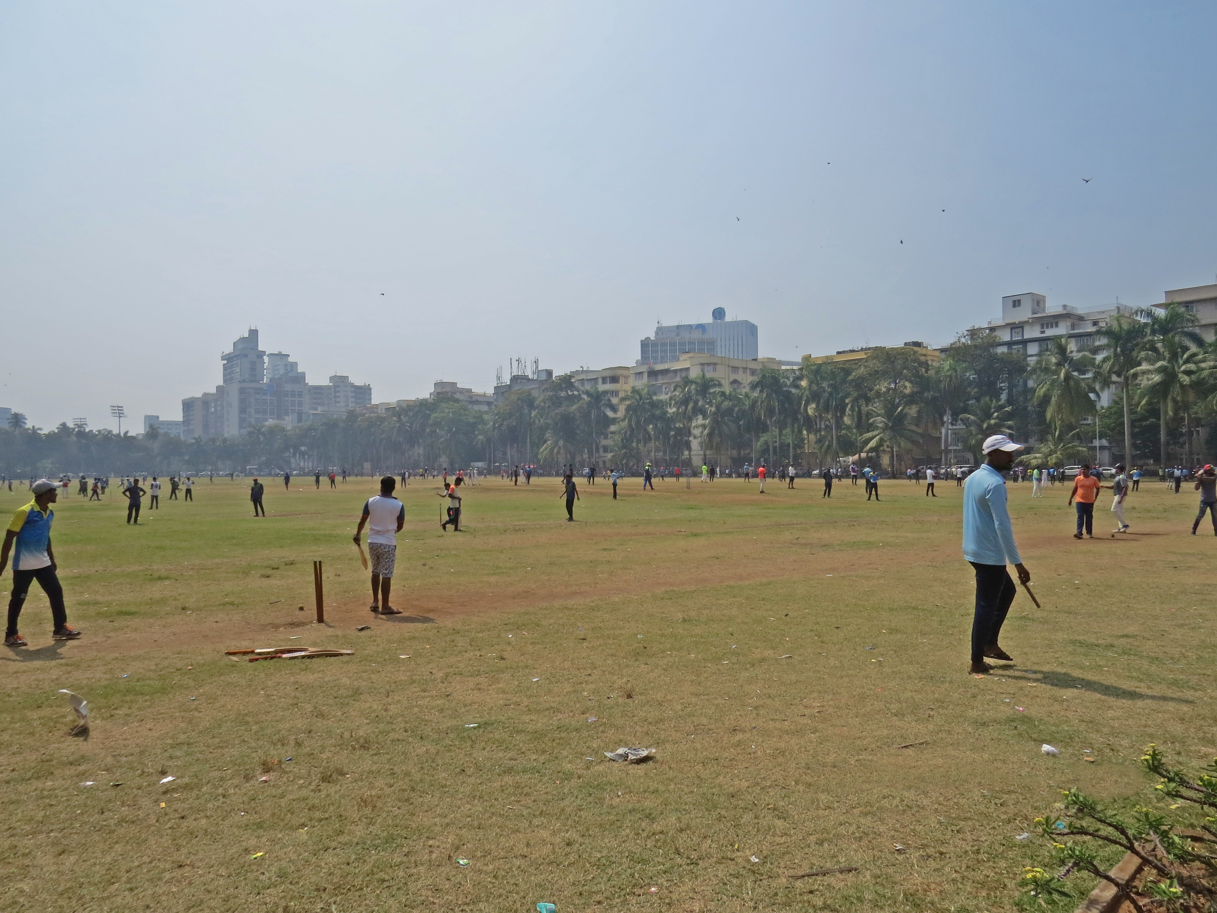 Boys play cricket on the dusty Oval Maidan in Mumbai (Harriet Line/PA)