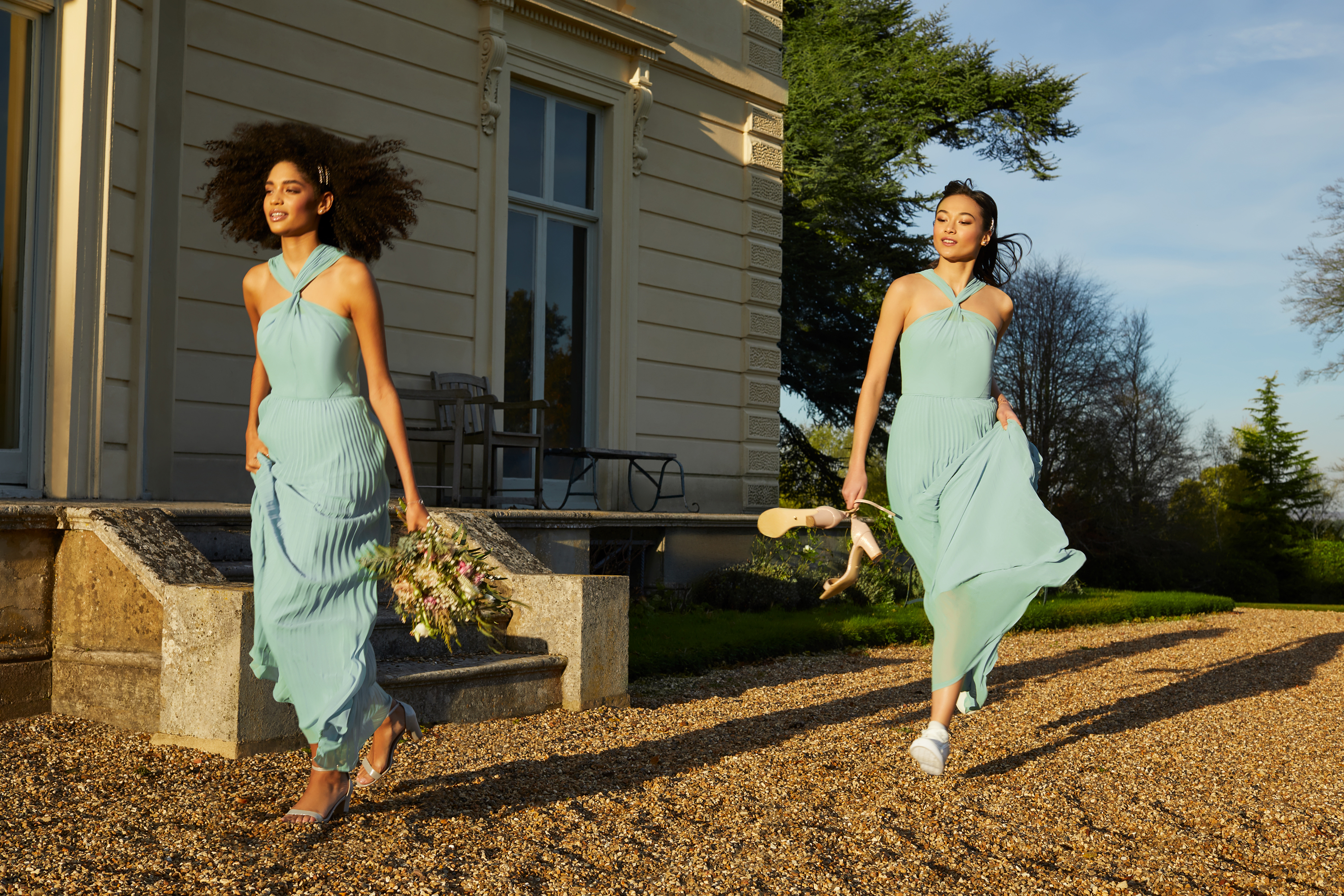 models wearing Oasis Pale Green Twist Neck Pleat Maxi Dress