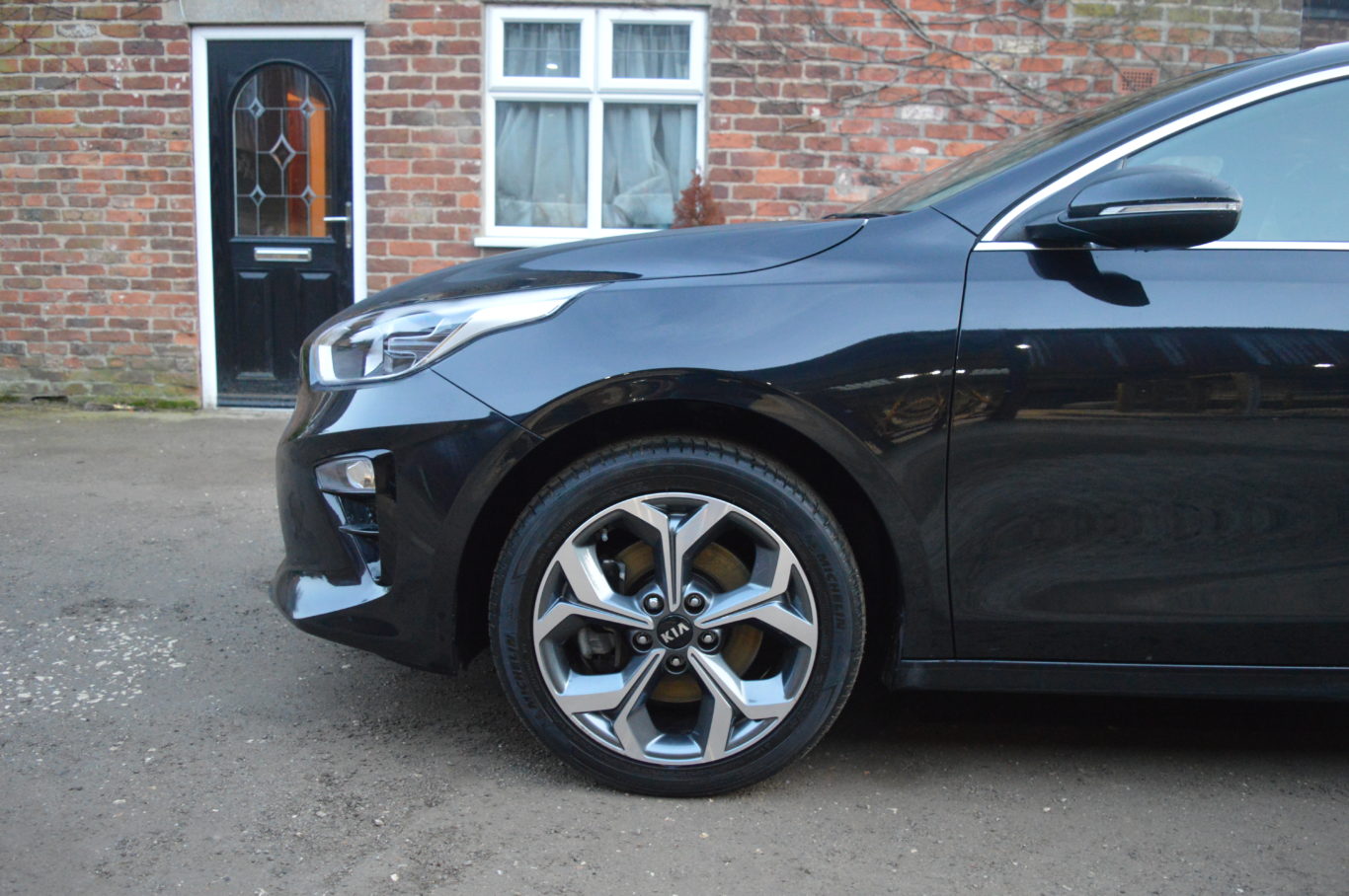 The Kia's large alloy wheels don't dent ride quality too much