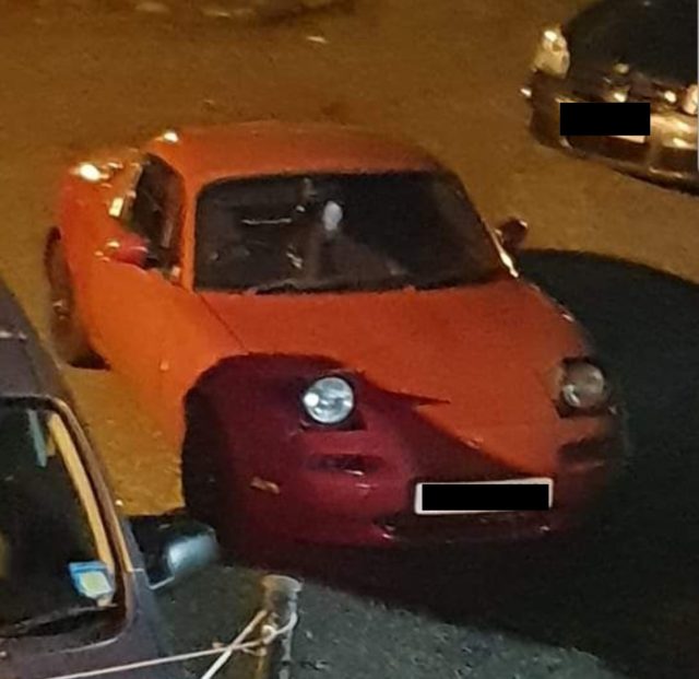 A red Mazda car