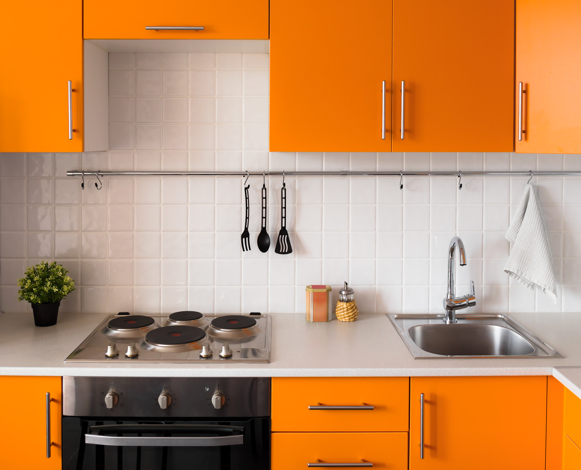 Vibrant orange cupboards provide an essential 'pop' of colour for an Aries home (ScS/PA)