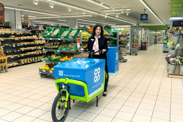Jo Whitfield, chief executive of Co-op Retail, with one of the delivery bikes. (Joel Chant/UNP Ltd)