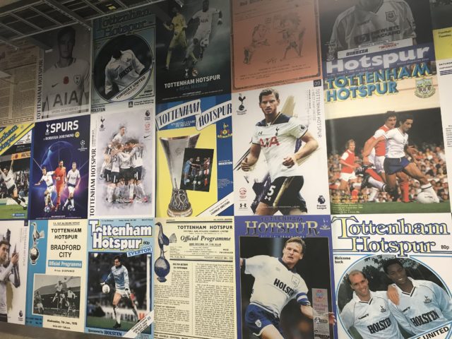 The concourse walls in Tottenham's new stadium are decorated with pictures of old matchday programmes The concourse walls in Tottenham's new stadium are decorated with pictures of old matchday programmes 