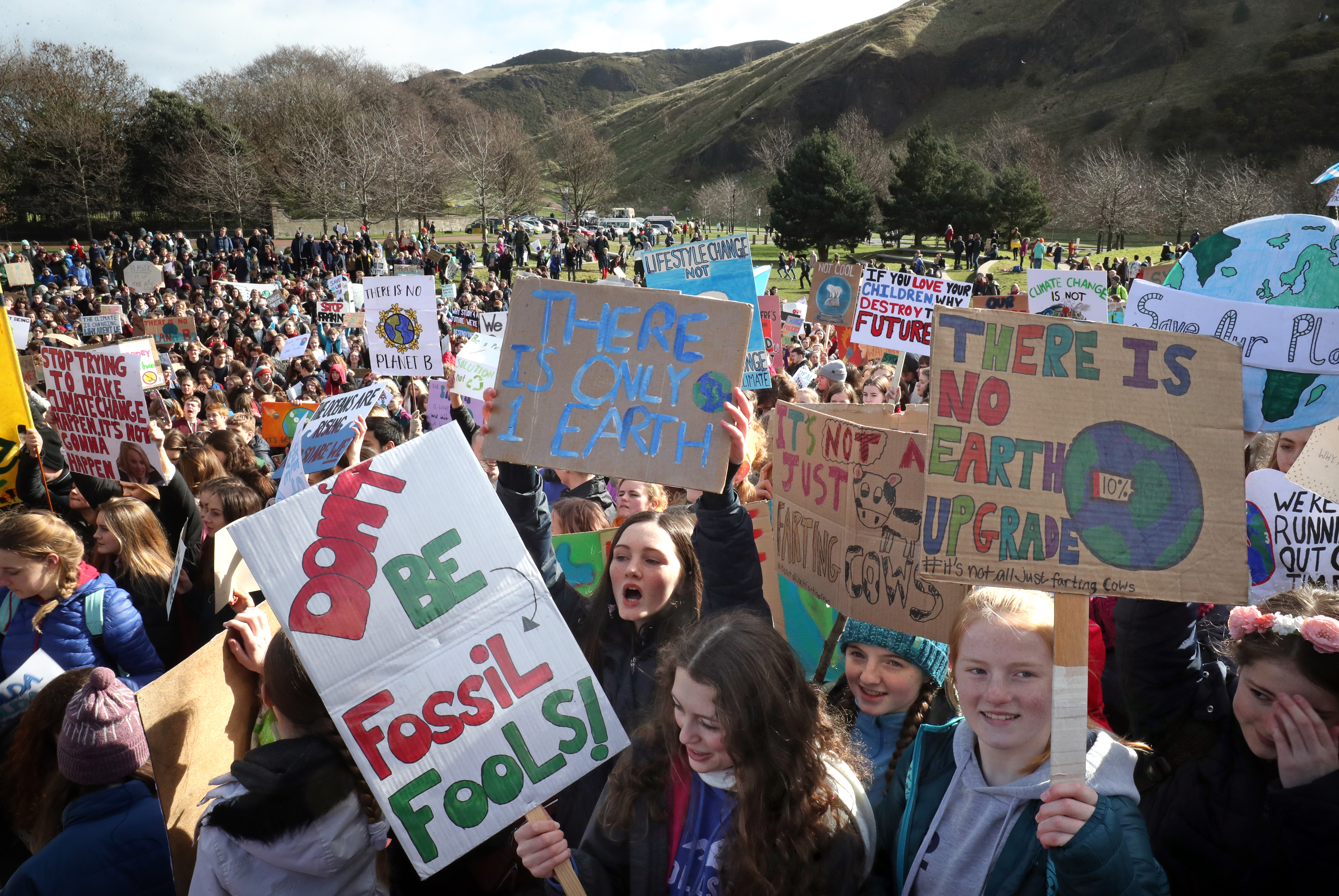 Students take part in a global school strike for climate change outside the Scottish Parliament building in Edinburgh, as protests are planned in 100 towns and cities in the U