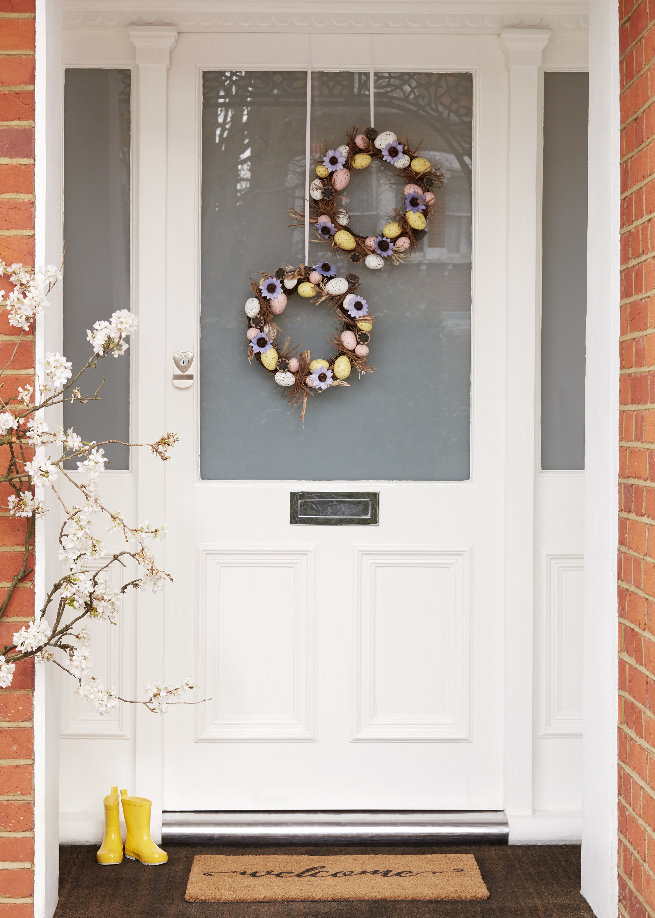 Easter Wreath, £25; Welcome Door Mat, Multi, £10, John Lewis (John Lewis/PA)