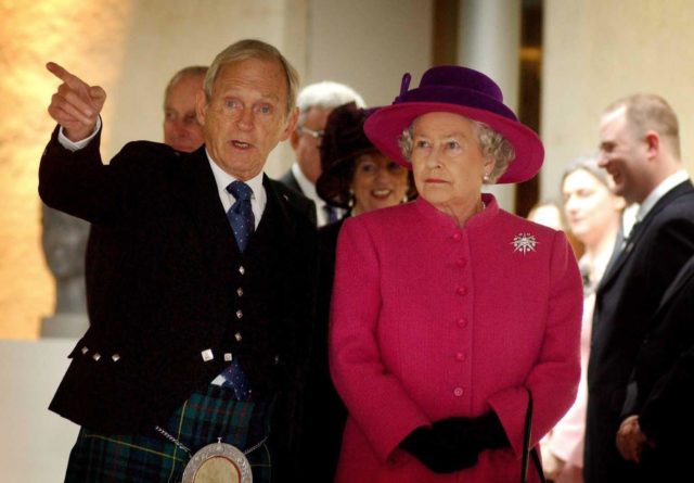 The Queen being shown around Holyrood on opening day by then presiding officer Sir George Reid