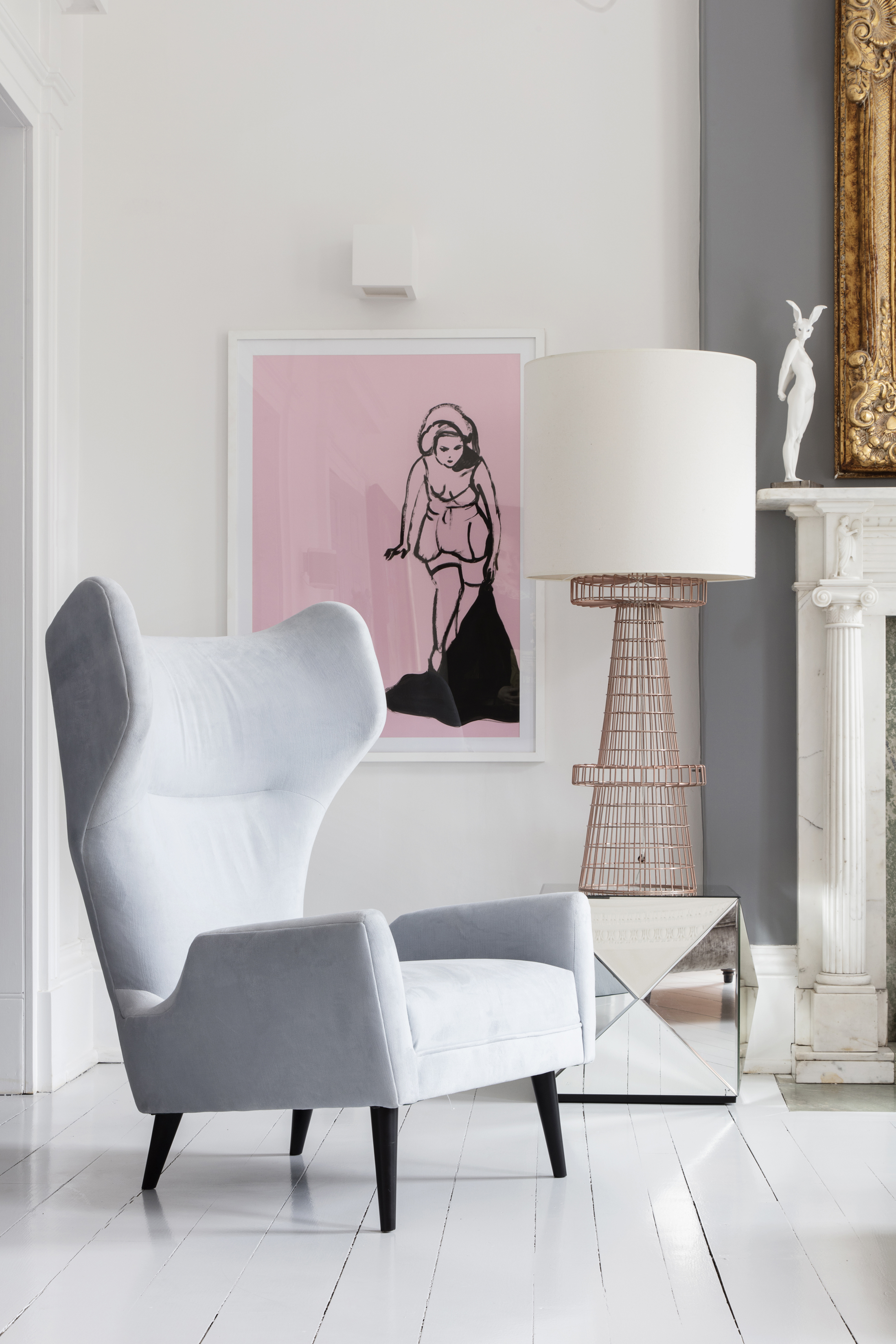 One pink print adds drama to a pared back space which features in Pink House Living: For People Cheating On Fashion With Furniture (Susie Lowe/Ryland Peters & Small/PA)