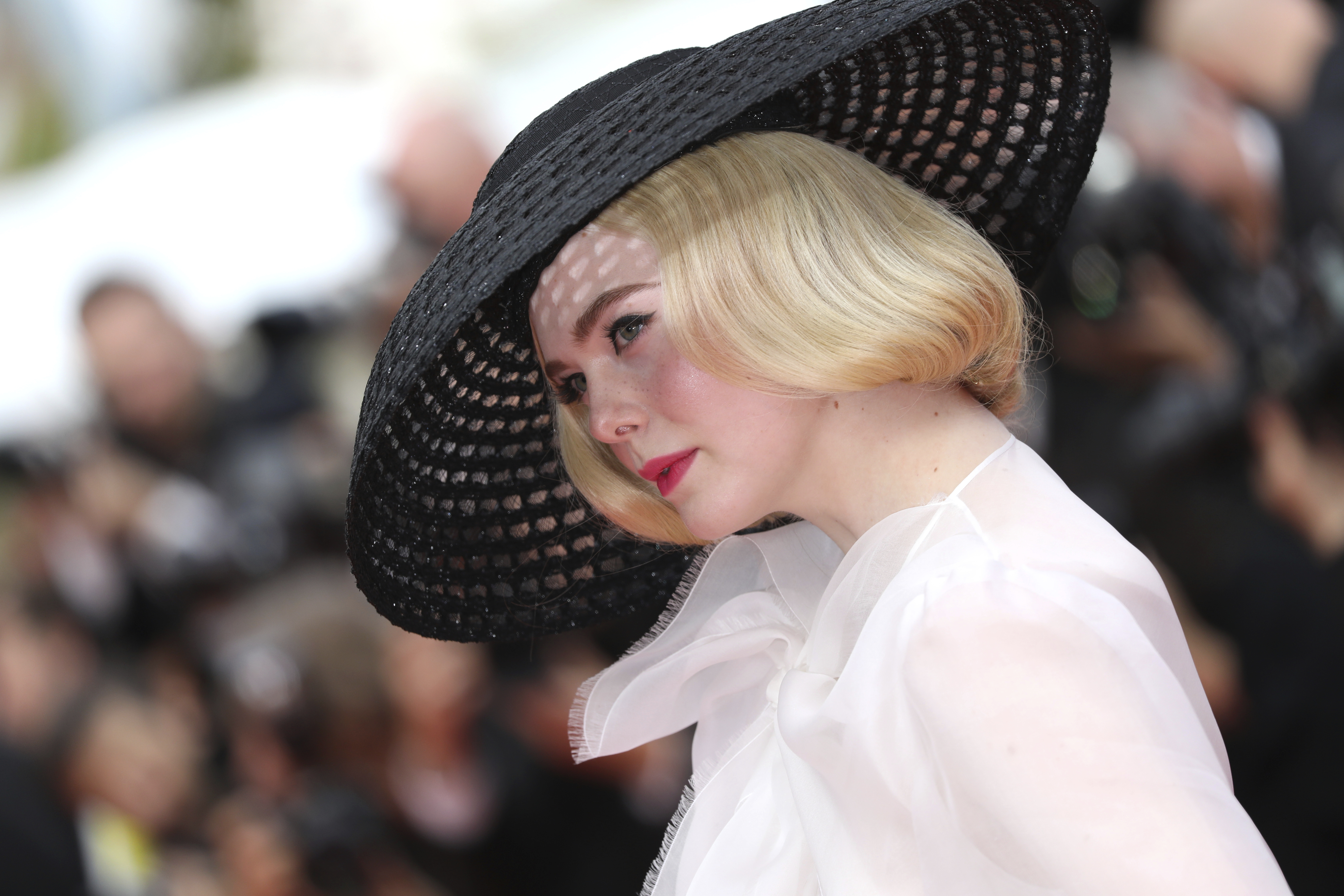 Jury member Elle Fanning poses for photographers upon arrival at the premiere of the film 'Once Upon a Time in Hollywood' at the 72nd international film festival, Cannes, southern France, Tuesday, May 21, 2019