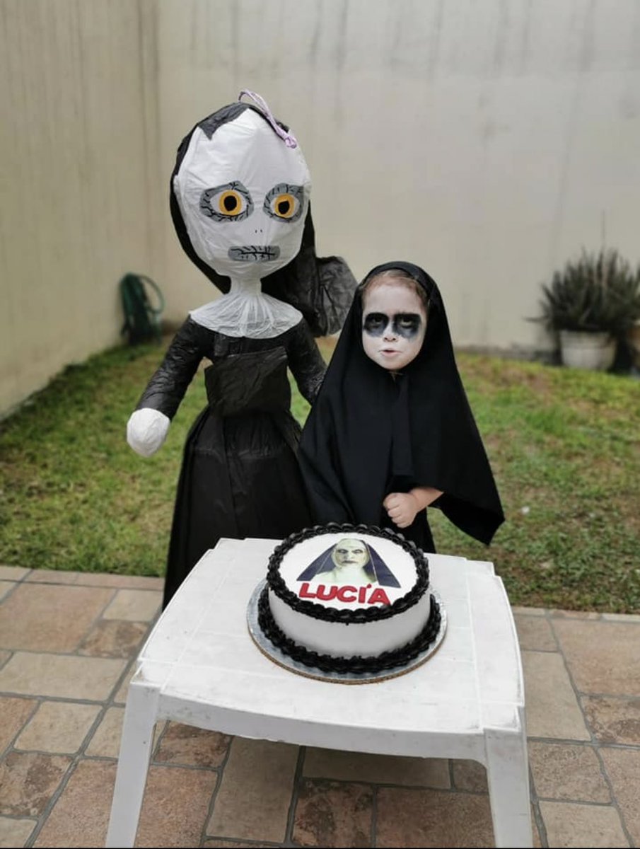 Lucia Brown enjoys her third birthday party dressed as a character from The Nun