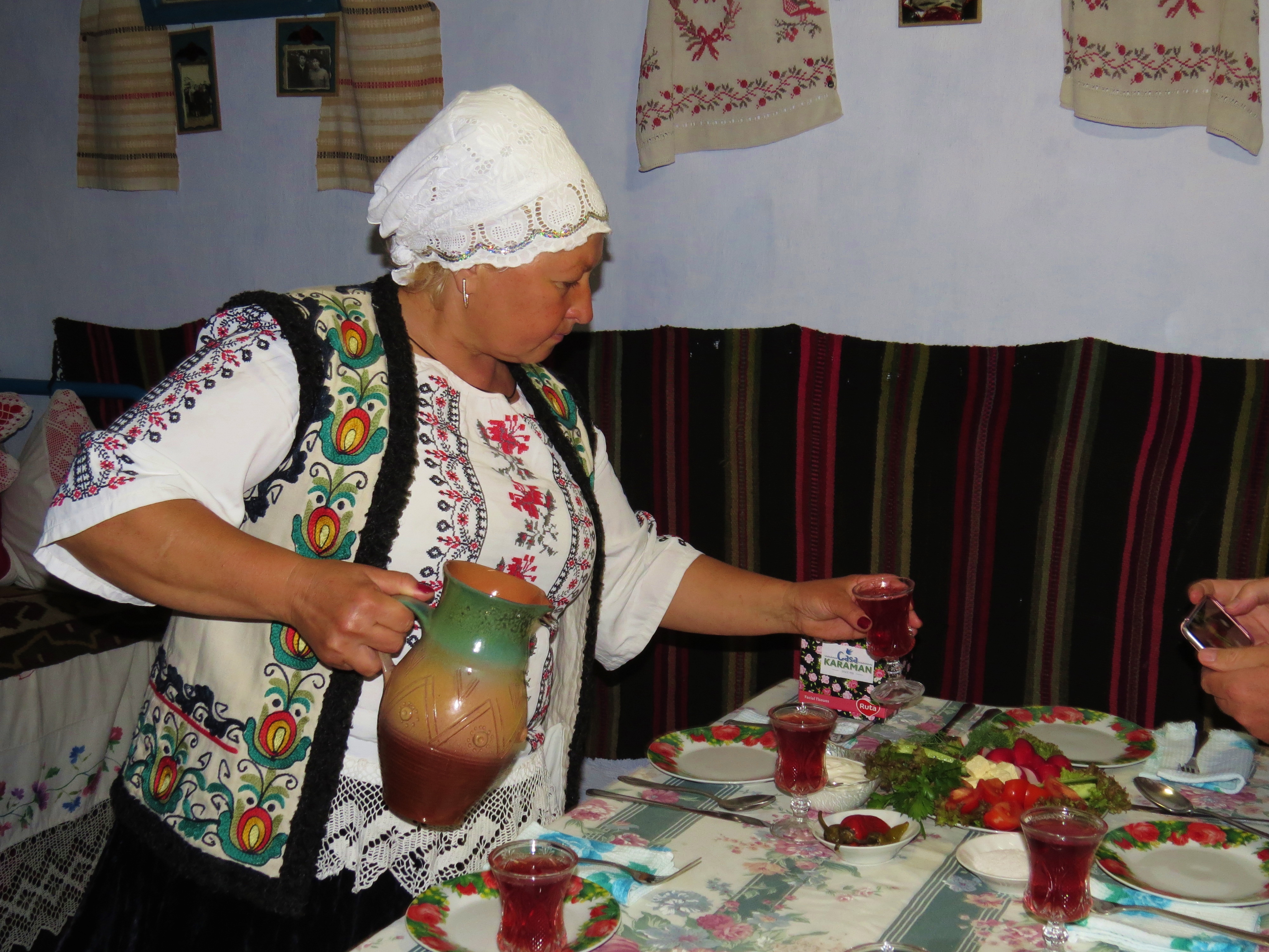 Anjela serves homemade wine with lunch at her home in Transnistria