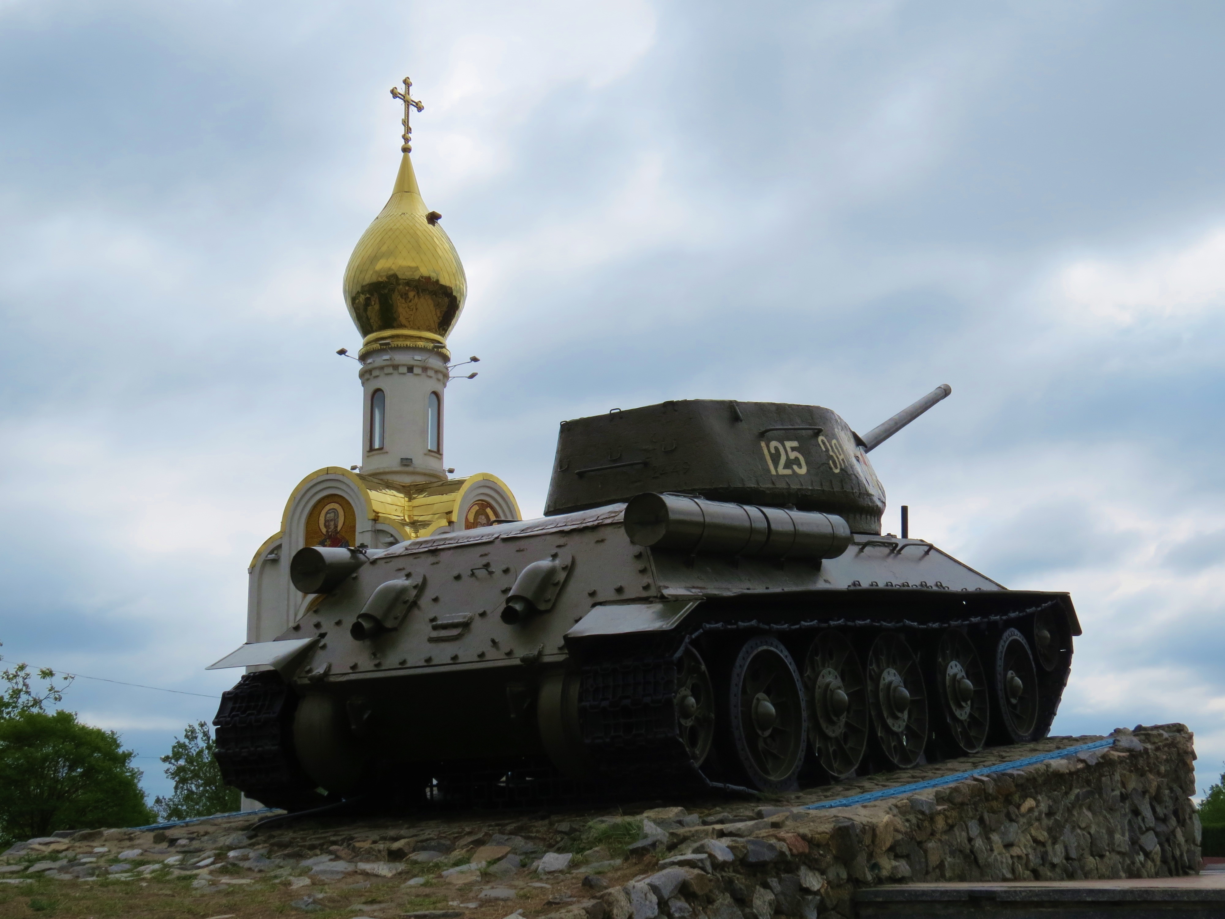 A Russian tank next to a church in the centre of Tiraspol