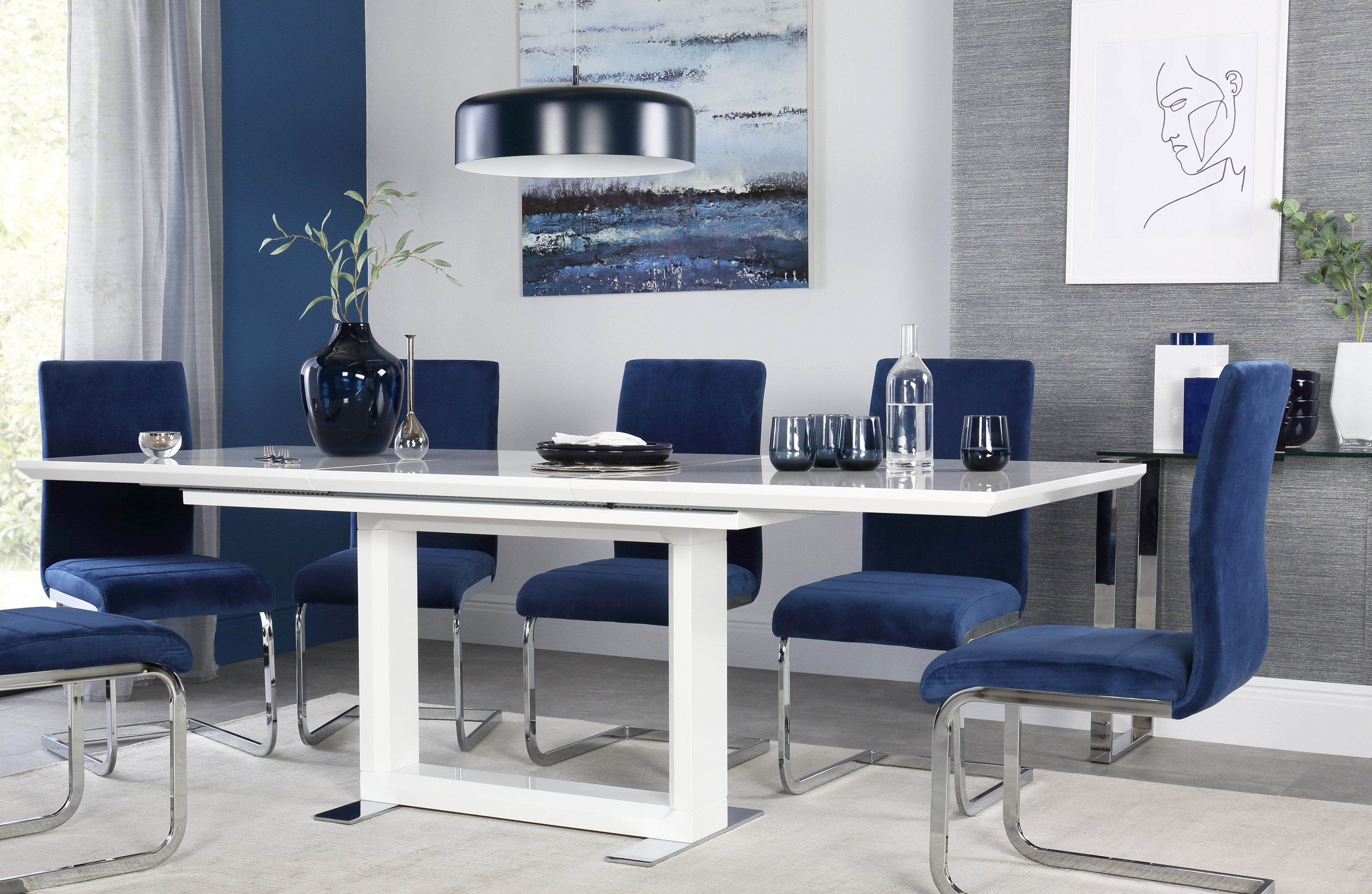 Tokyo White High Gloss Extending Table With 4 Perth Blue Velvet Chairs, currently reduced to £649.99 from £1,099.95, Furniture Choice (Furniture Choice/PA)