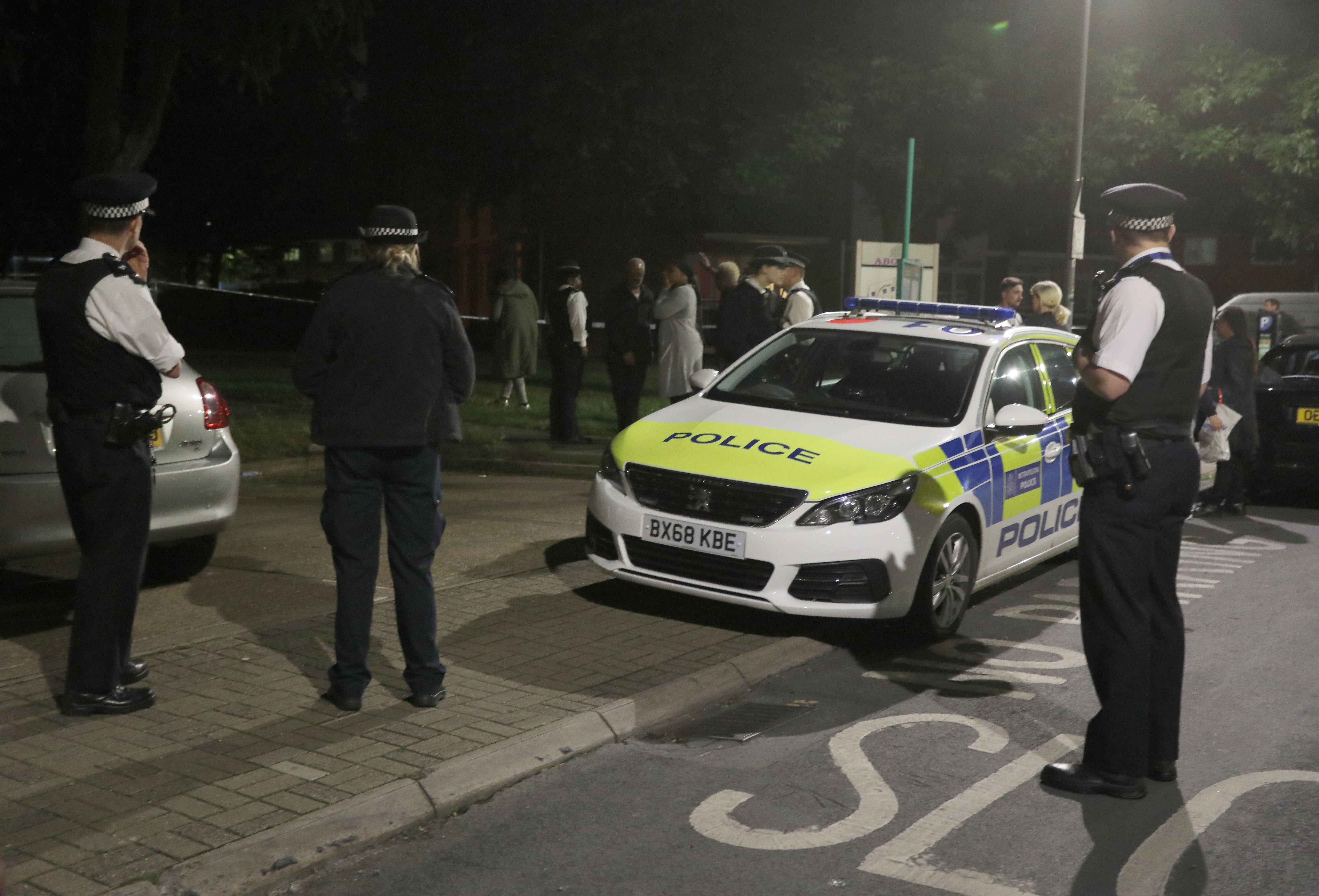 Police officers near to the scene in Deeside Road in Wandsworth (Isabel Infantes/PA)