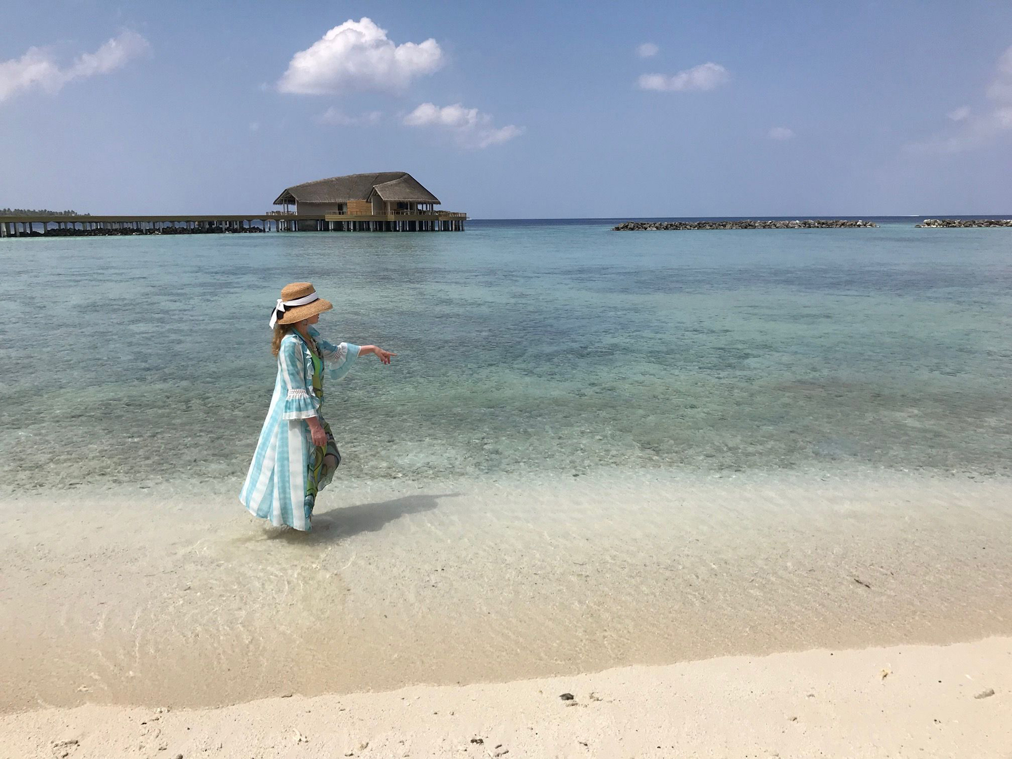 Sam walking along the shoreline watching reef sharks (SWH/PA)