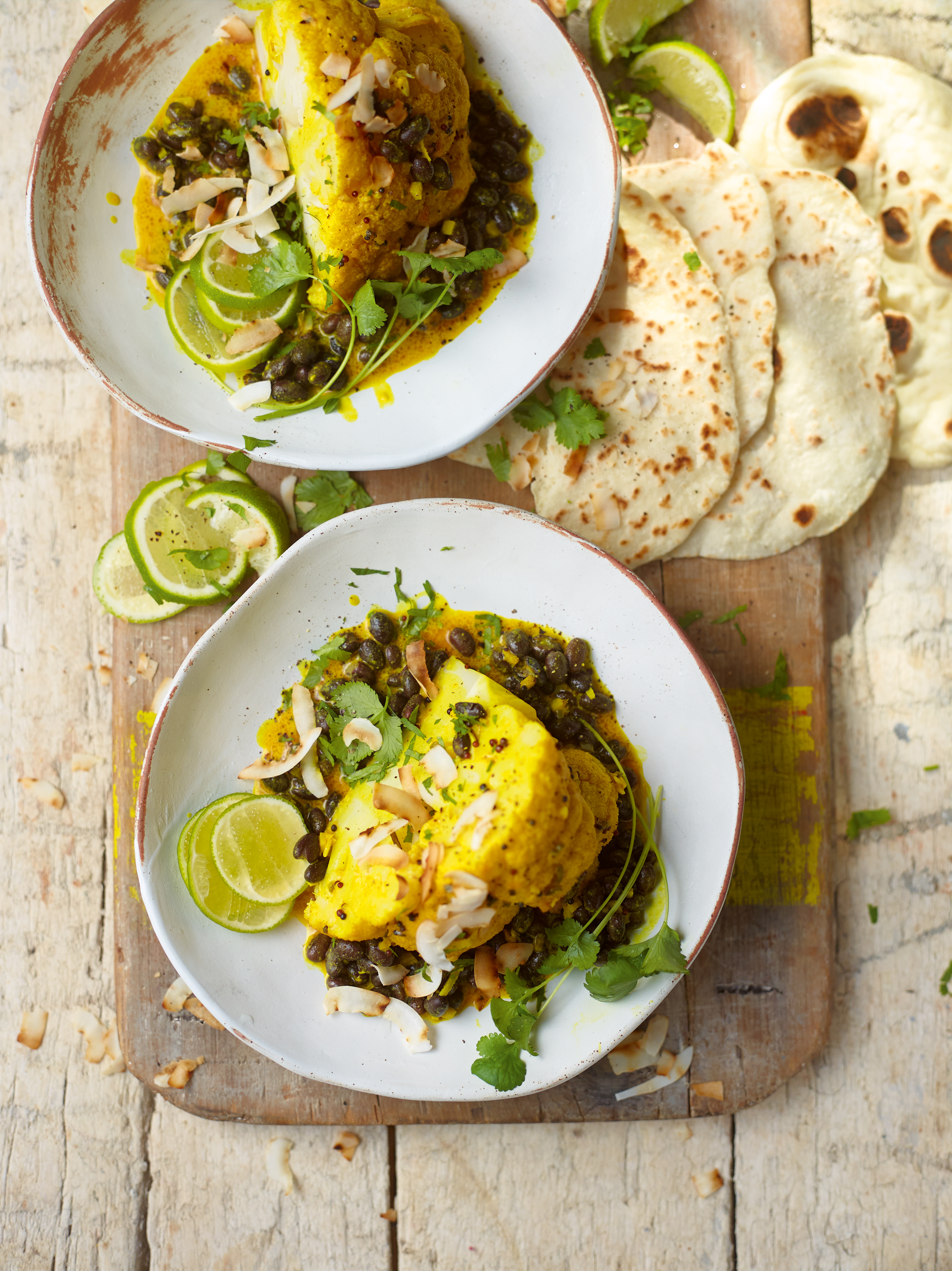 Baked cauliflower with black beans and coconut from Ainsley’s Caribbean Kitchen by Ainsley Harriott (Ebury/Dan Jones/PA)