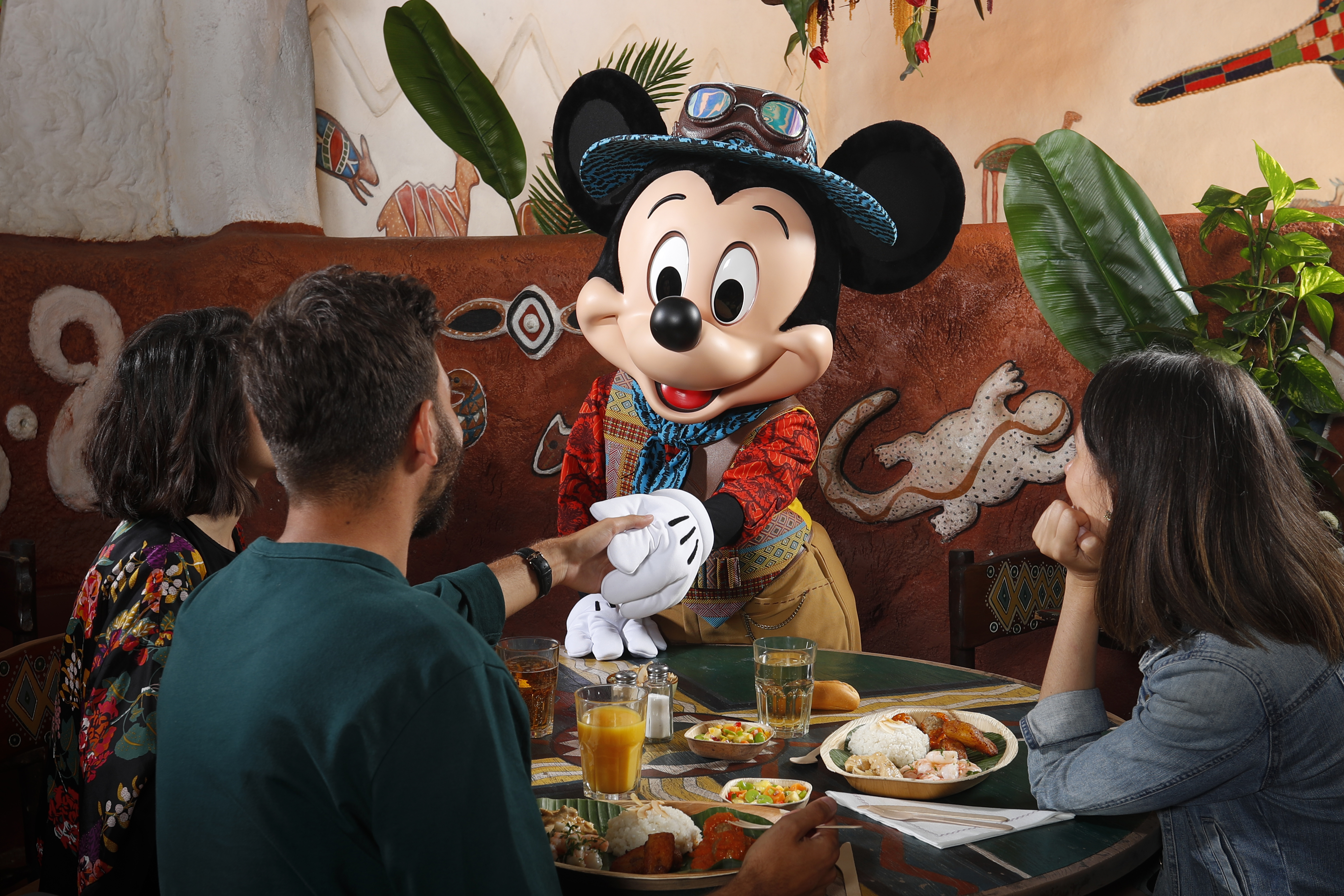 Mickey Mouse meeting guests at the Hakuna Matata restaurant at Disneyland Paris (PA/Disney)