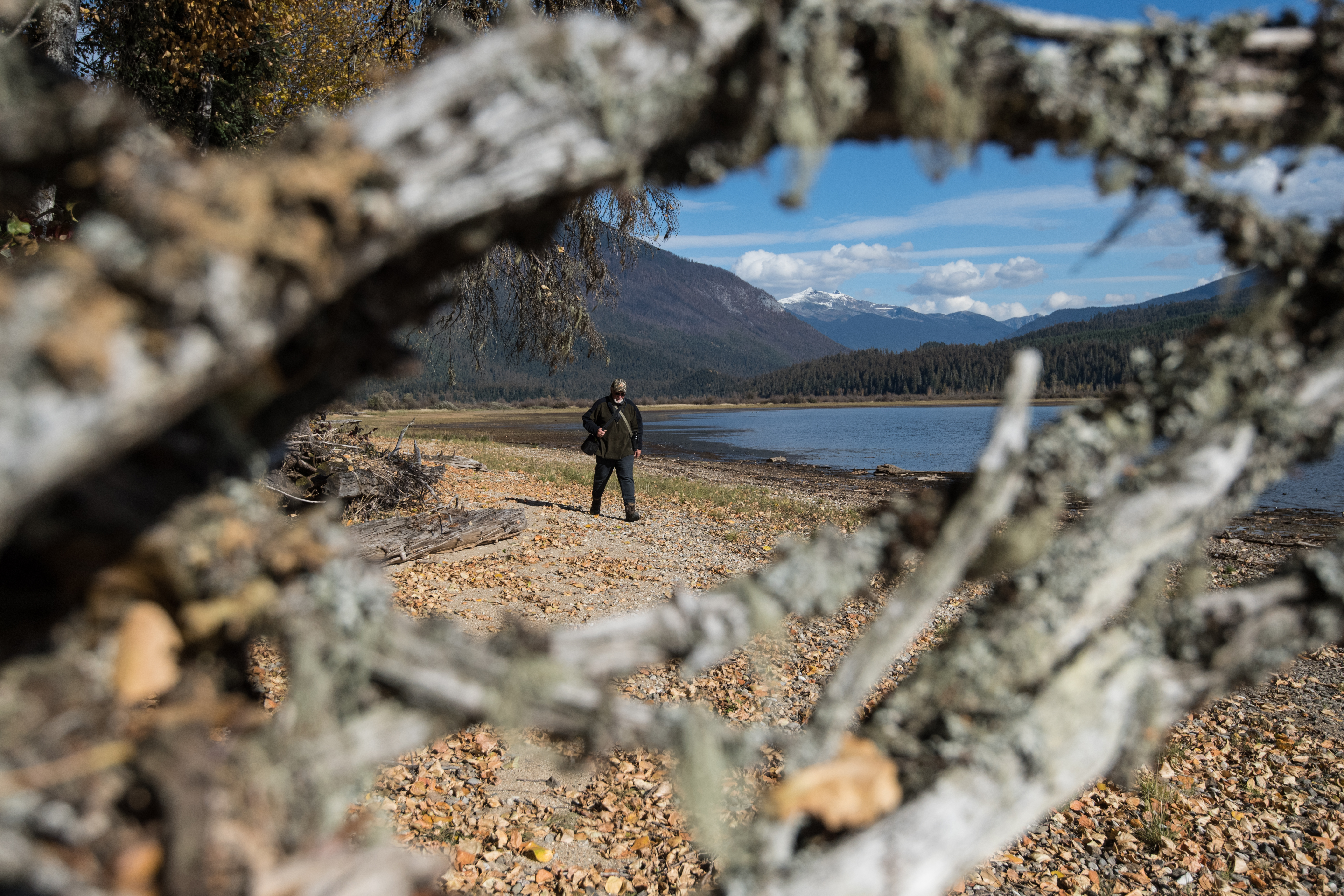 Gary Zorn walks along the shore of Quesnel Lake (Sarah Marshall/PA)