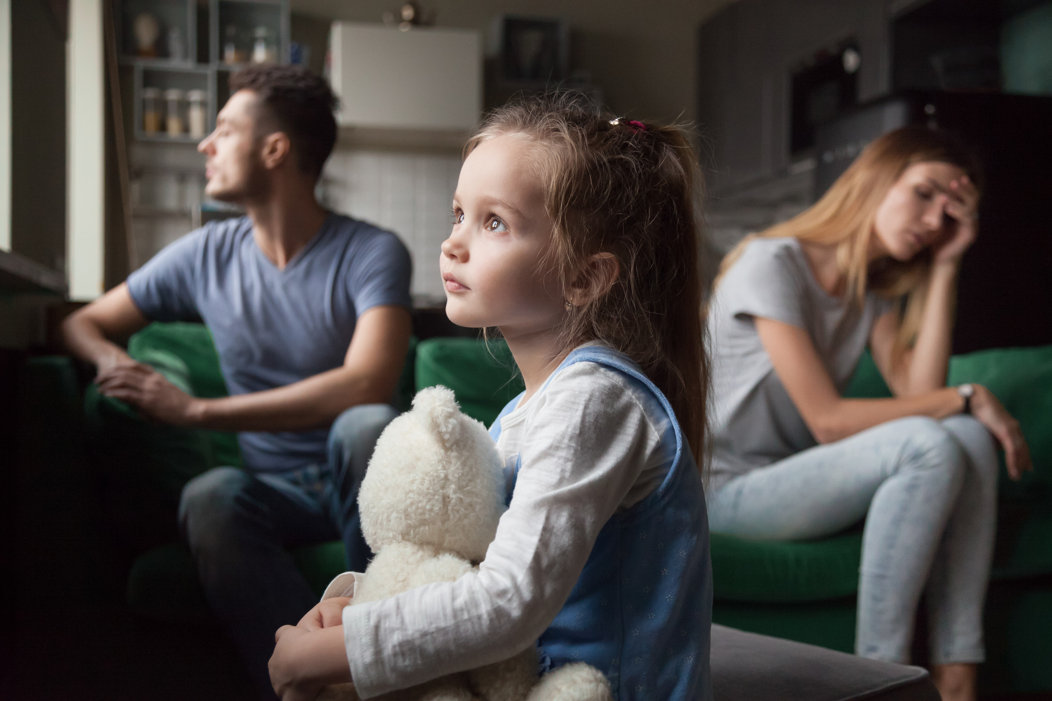 Sad little girl whose parents are fighting