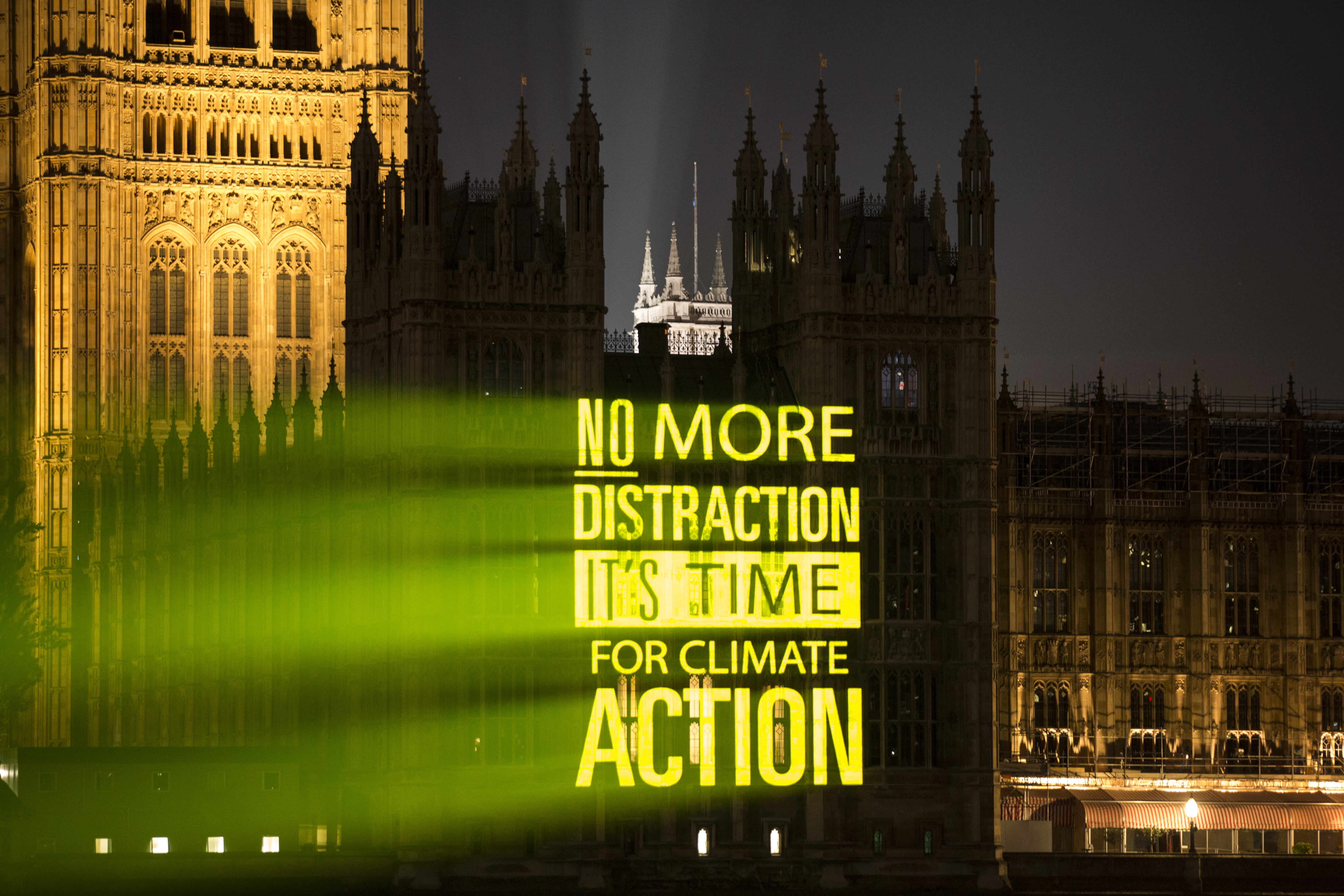UK Student Climate Network projected messages on landmarks including parliament promoting the strike (Samuel Keyte)