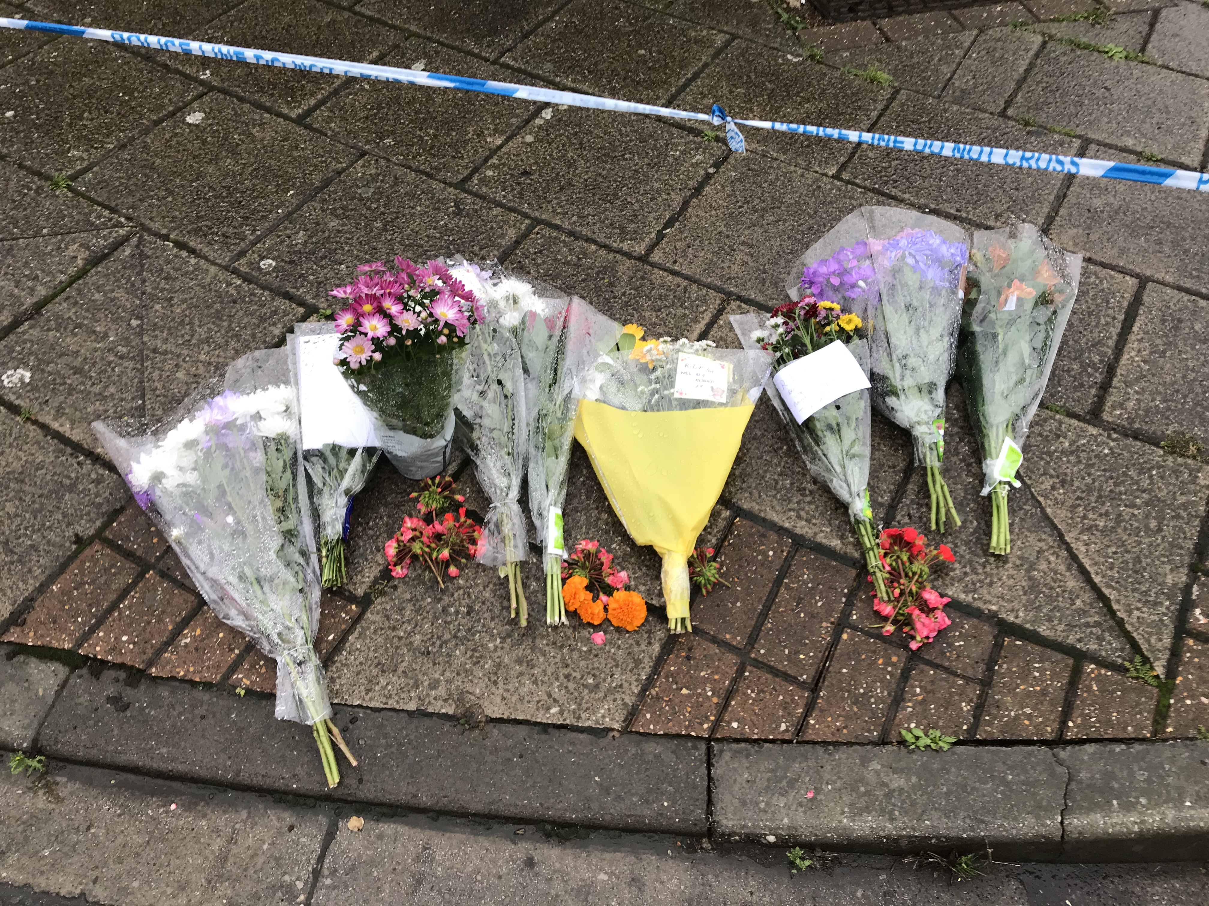 Tributes left outside a property in Edinburgh Drive, Wisbech