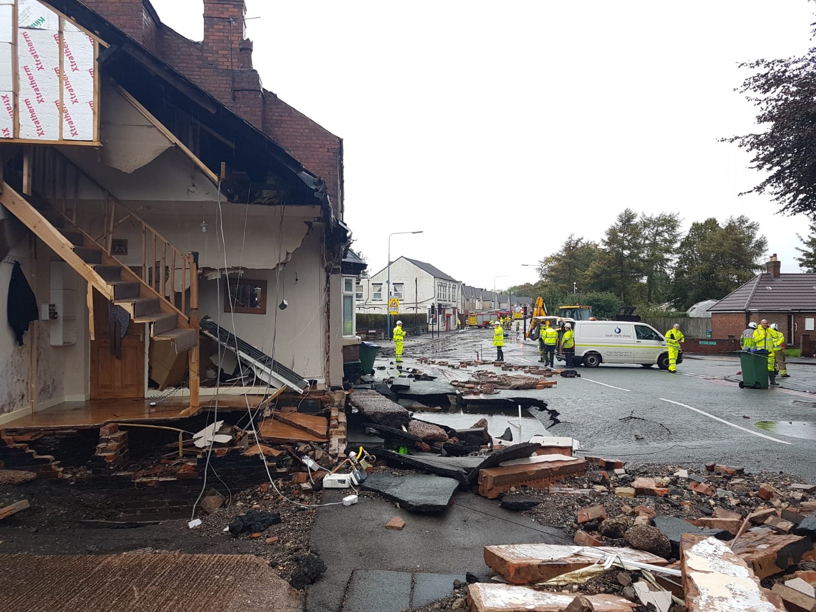 A burst water main has caused damage in Birmingham, where a house has partially collapsed (West Midlands Fire Service/PA)
