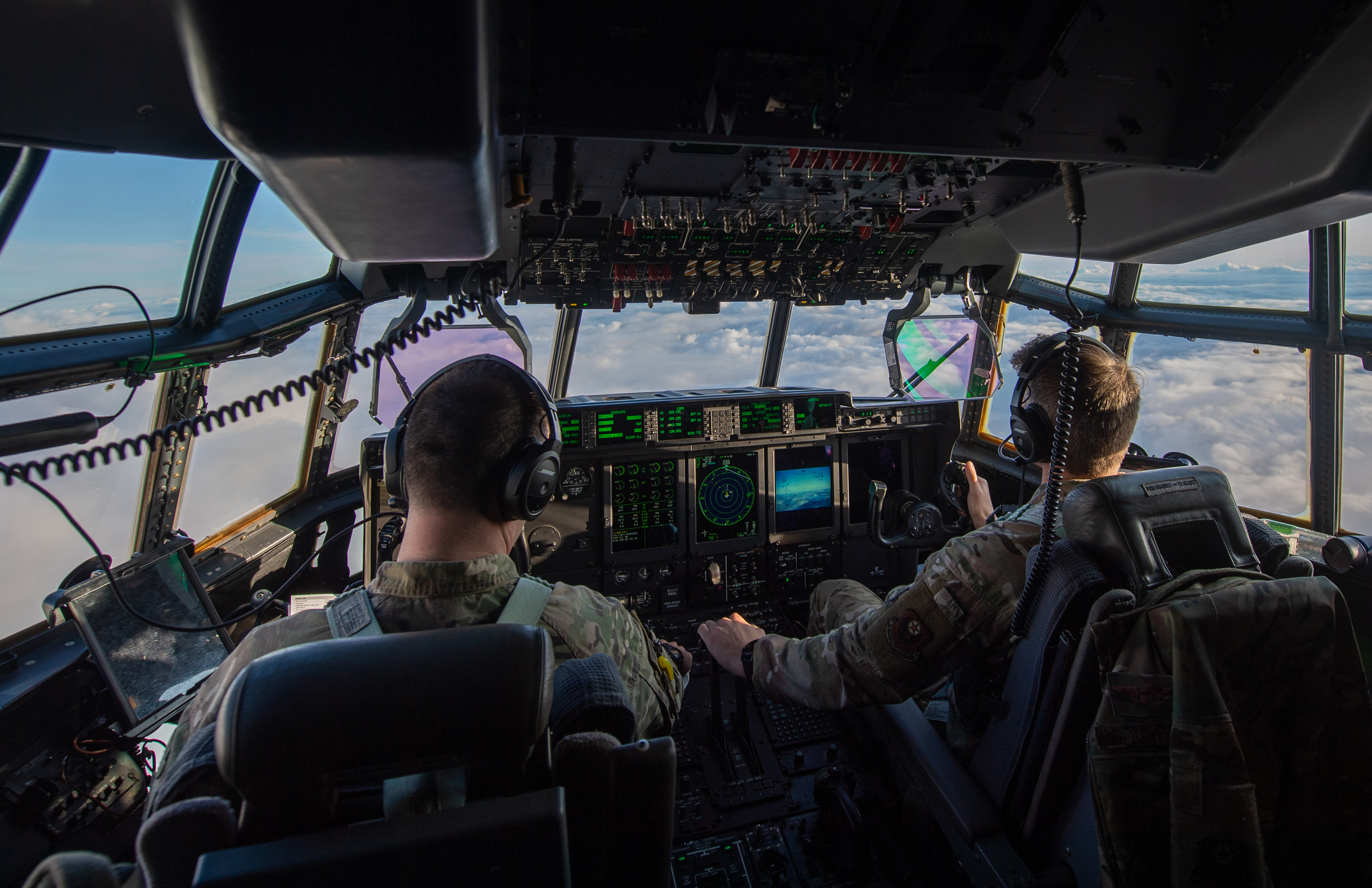 Aircrew in the cockpit of a USAF MC-130J Commando II cargo plane during operation Point Blank. (Joe Giddens/ PA)