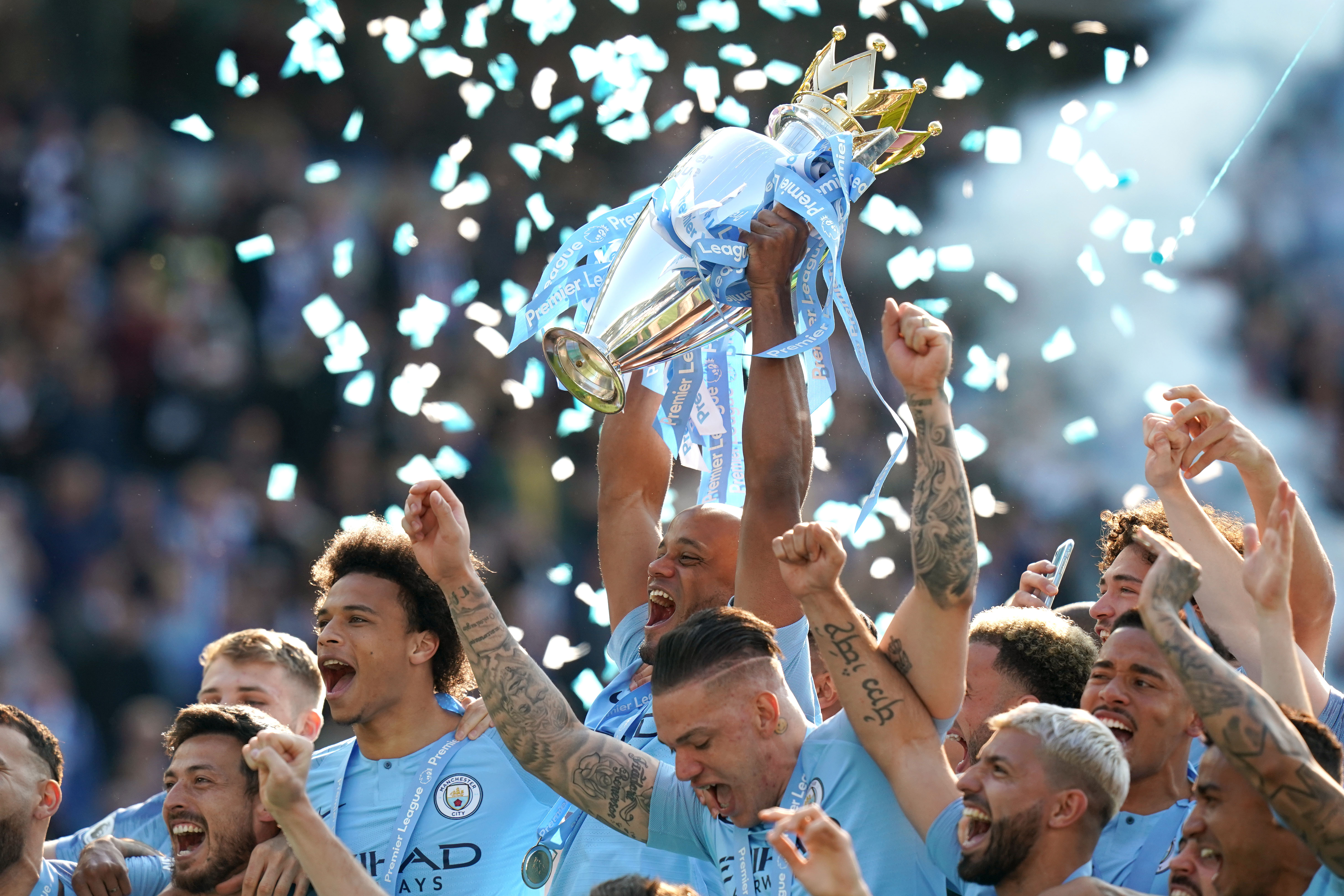 Manchester City captain Vincent Kompany lifts the Premier League trophy at Brighton in May at the end of a thrilling title race. Pep Guardiola's side retained their crown after coming from a goal down to win 4-1 at the Amex Stadium and finish a single point ahead of rivals Liverpool