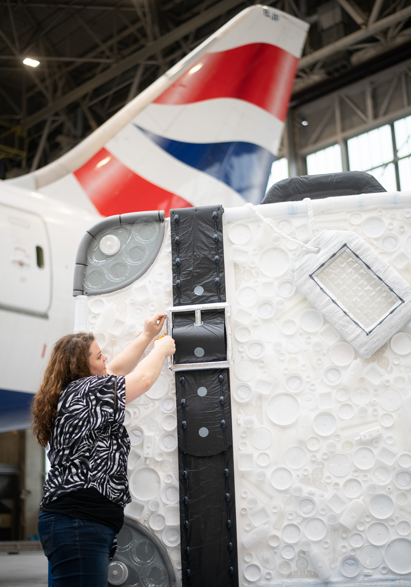Eco-artist Sarah Turner adds the finishing touches to her creation (British Airways/PA)