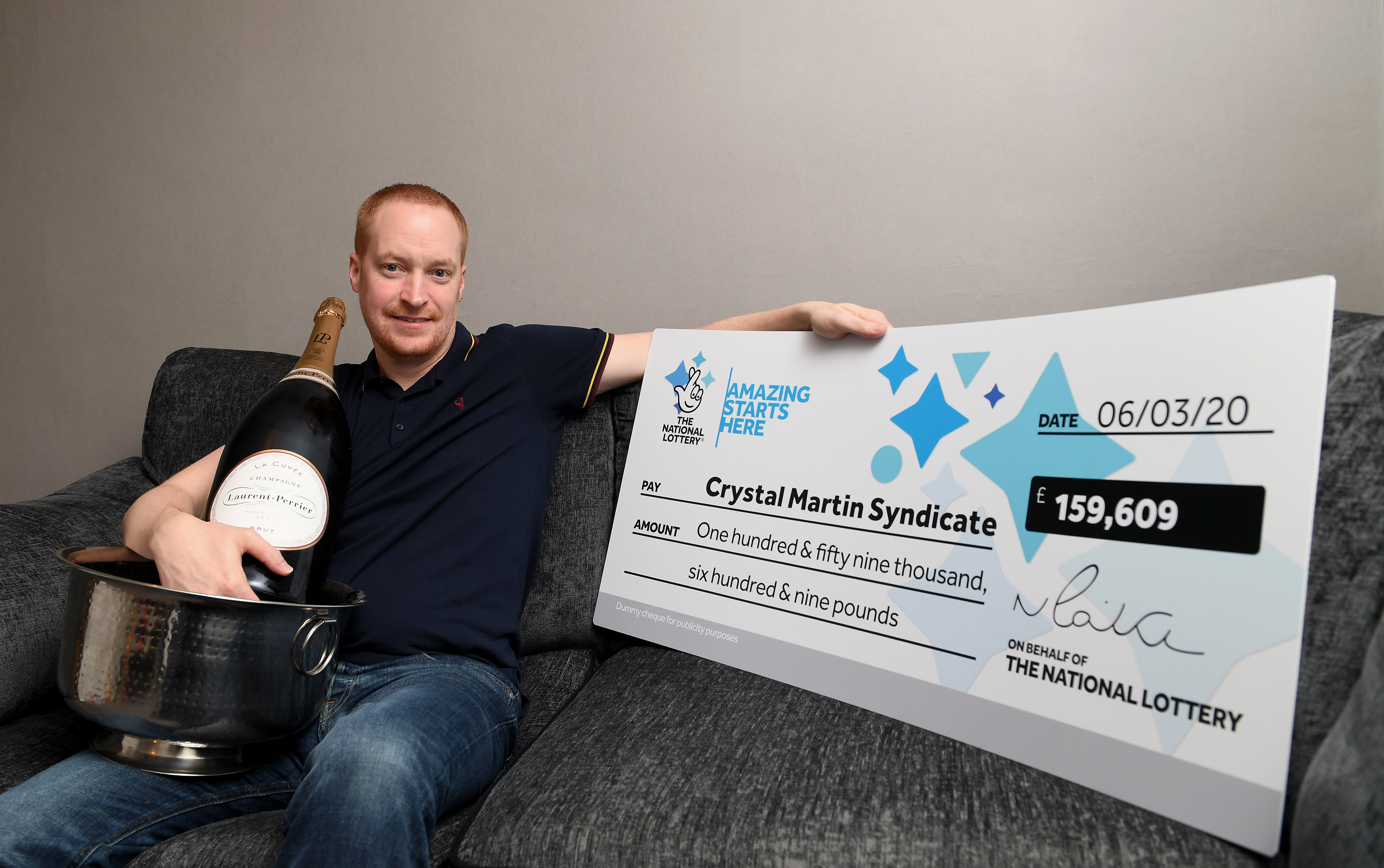 Mr Rowland wrote out cheques for all syndicate members with their winnings (Camelot/PA Wire)