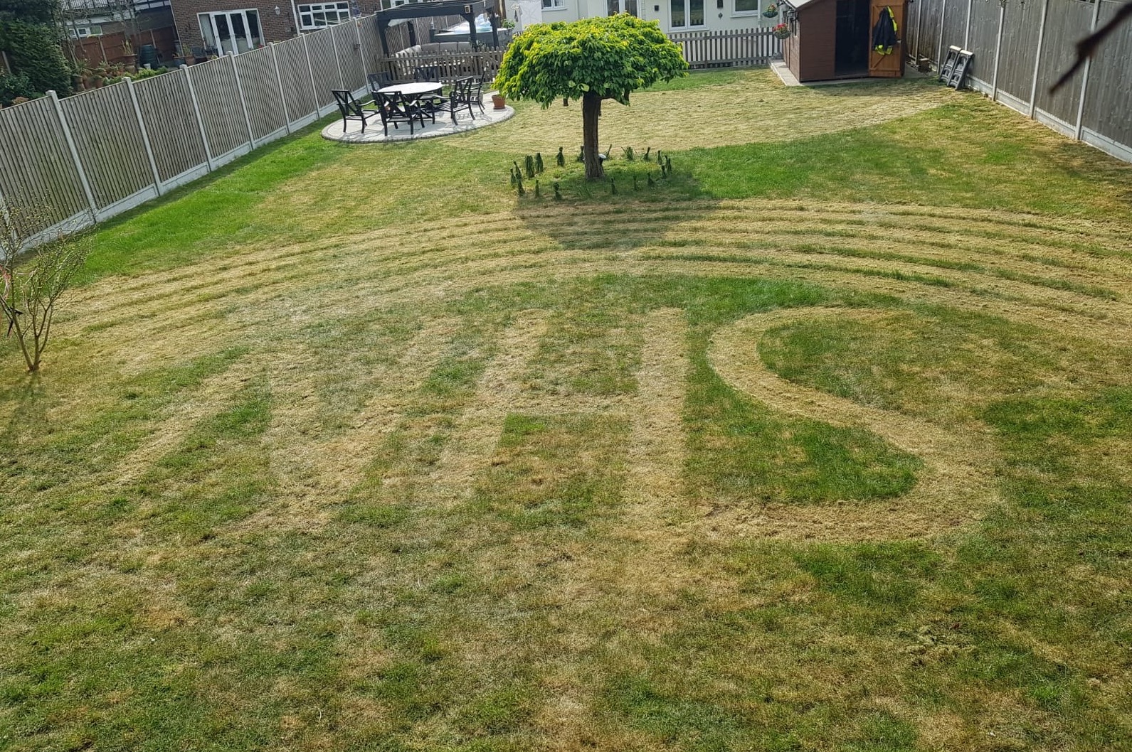 National Lottery winner Barry Maddox, of Billericay in Essex, mowed the NHS logo and a rainbow into his lawn after his dad died with coronavirus. (Barry Maddox/ PA)