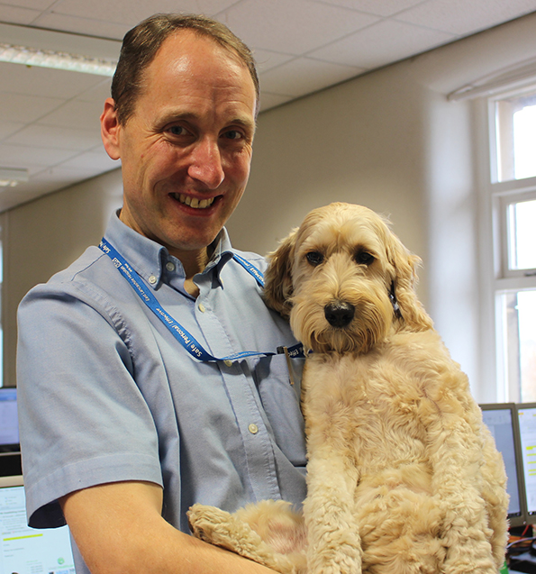 Hospital chaplain David Anderson and therapy dog Jasper