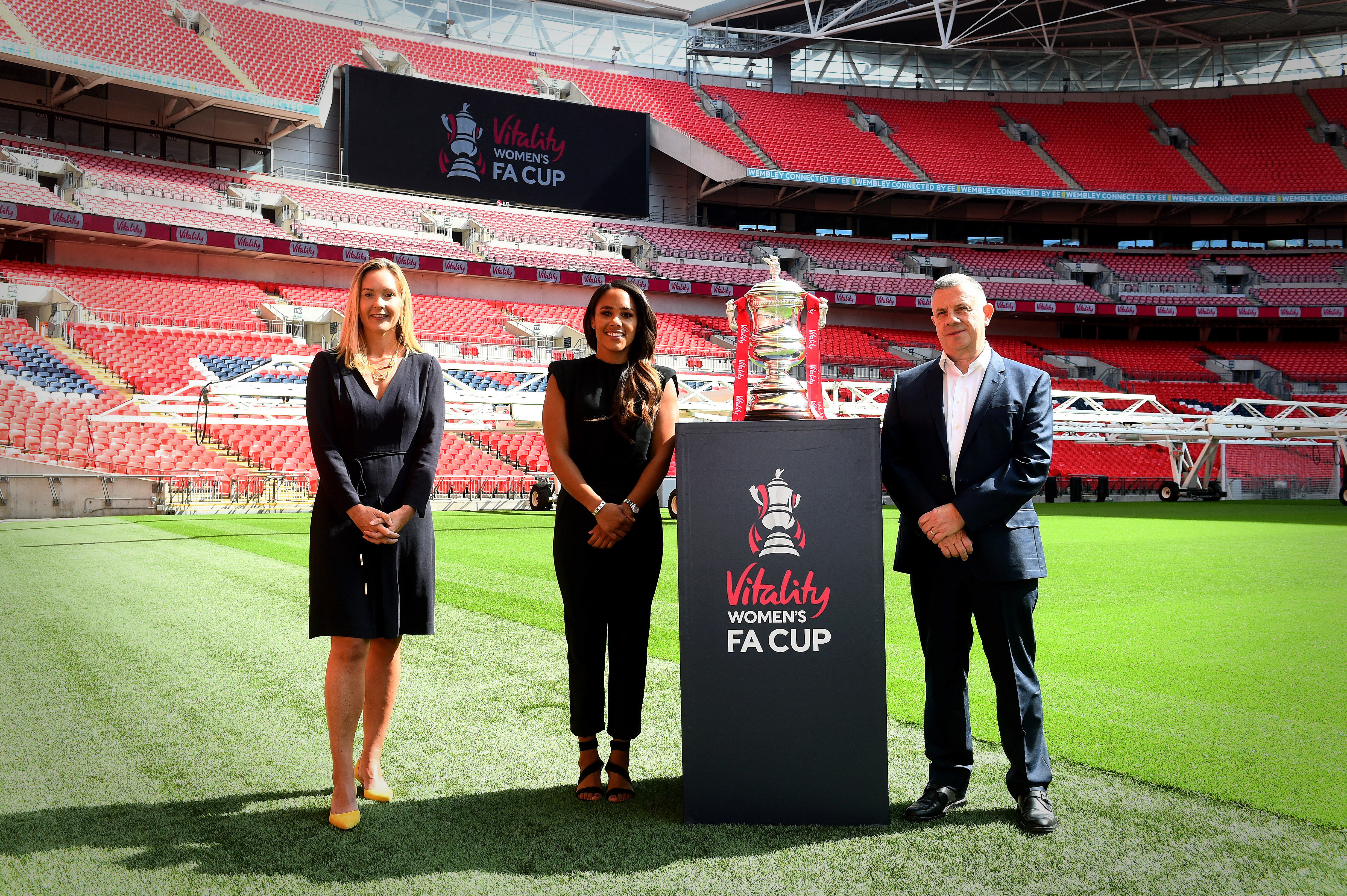 Alex Scott, centre, is an ambassador for Vitality, which has struck a deal to sponsor the Women's FA Cup. The former England defender is pictured alongside Vitality CEO Neville Koopowitz, right, and the FA marketing director Kathryn Swarbrick