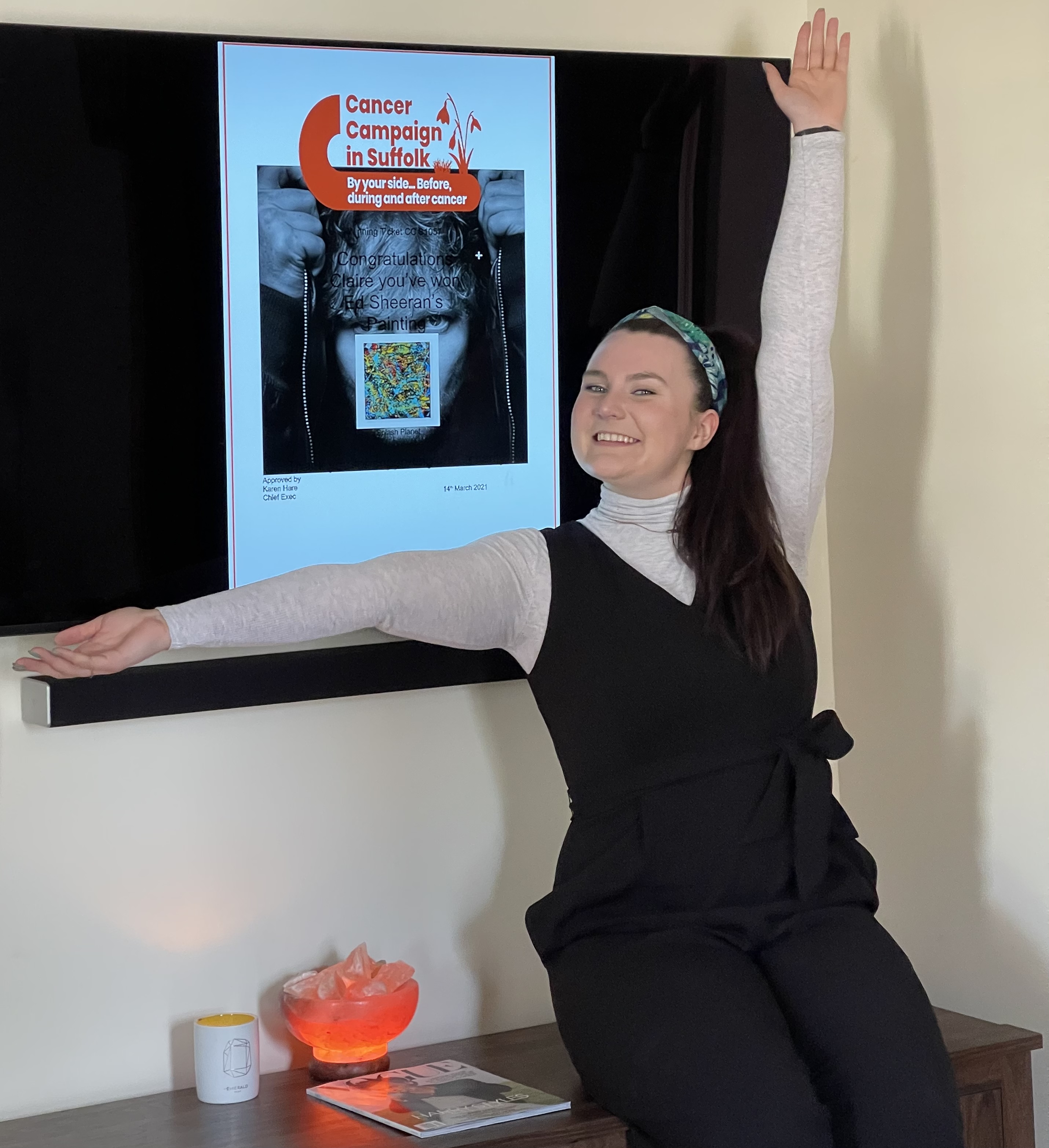 Claire Faynor, 22, of Vermont, won a painting by pop star Ed Sheeran after buying a £20 raffle ticket (Claire Faynor/ PA)