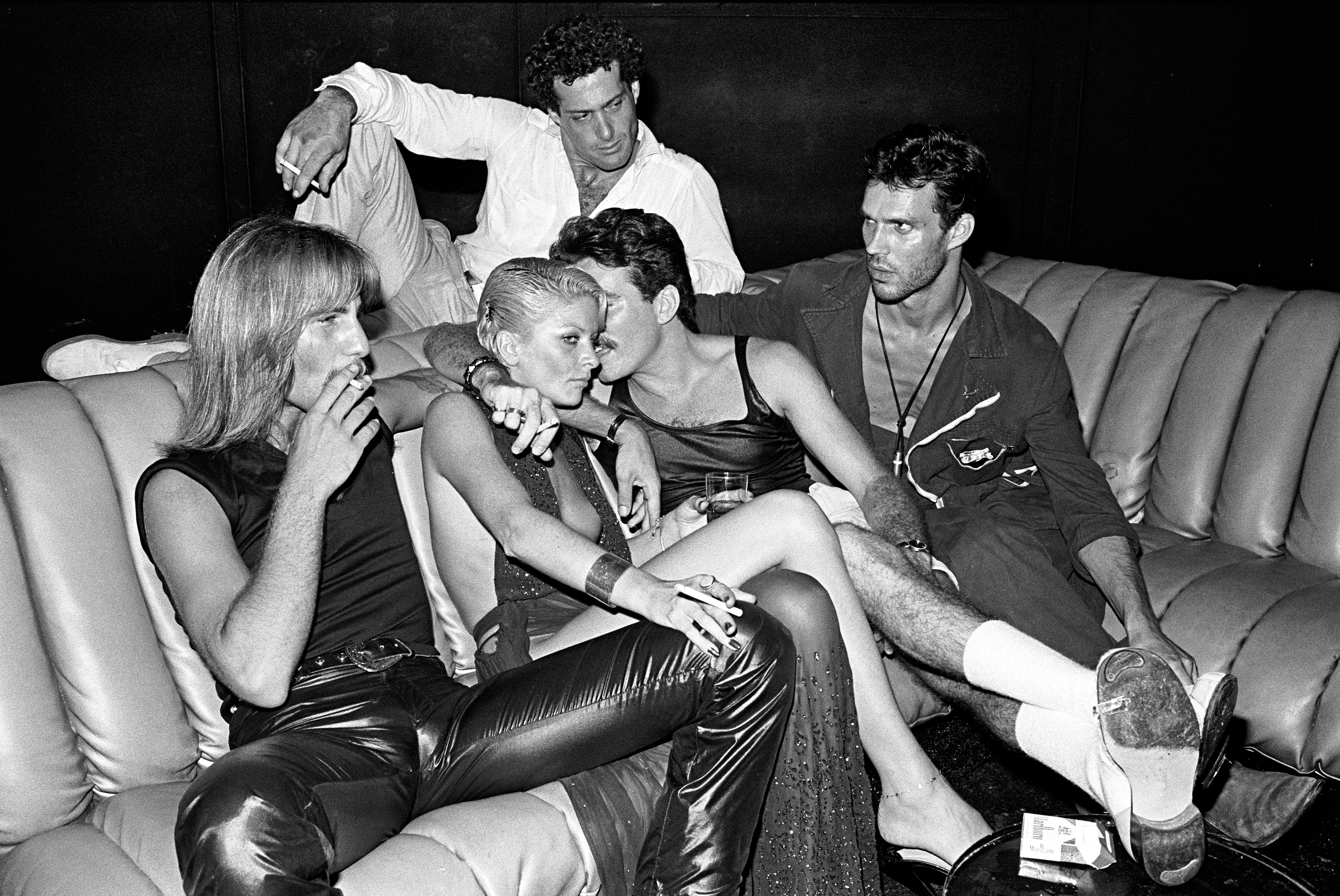 Guests in conversation on a sofa