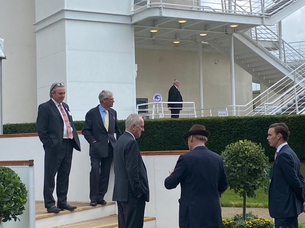 John and Thady Gosden talk to owner Bjorn Nielsen at Goodwood