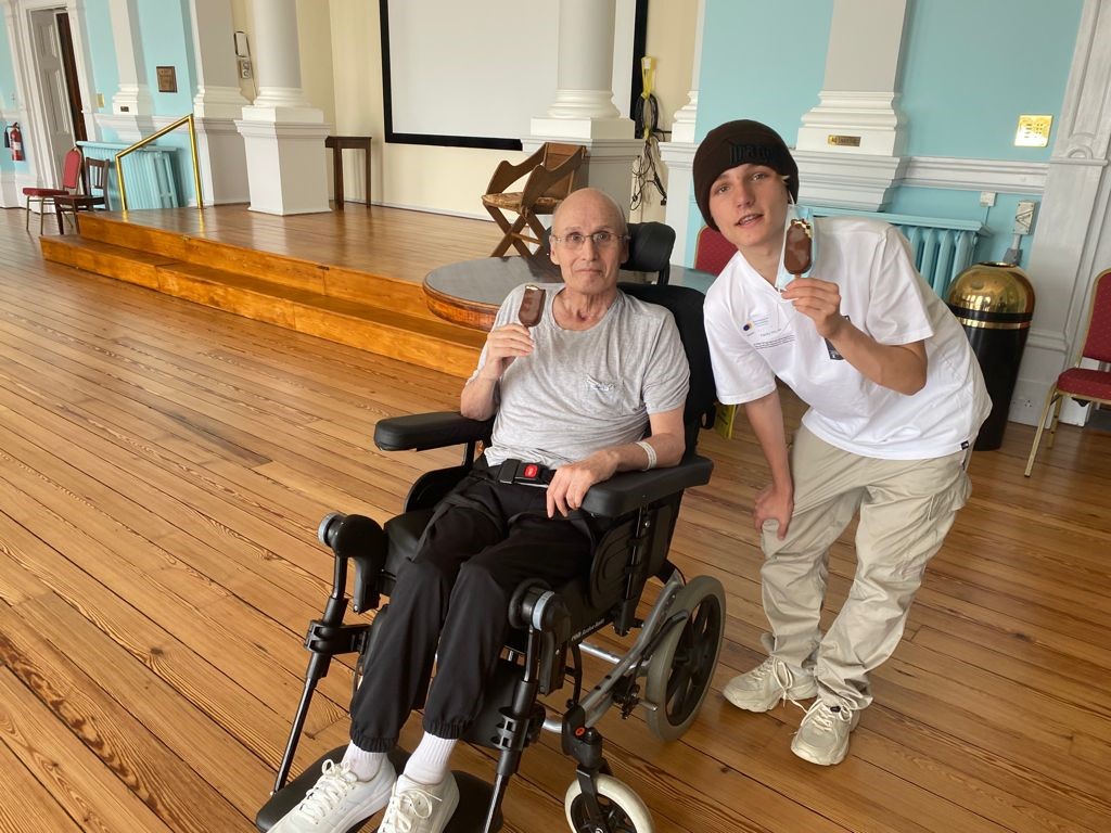 Eddie Brower with his grandson Blake, 15, eating ice cream